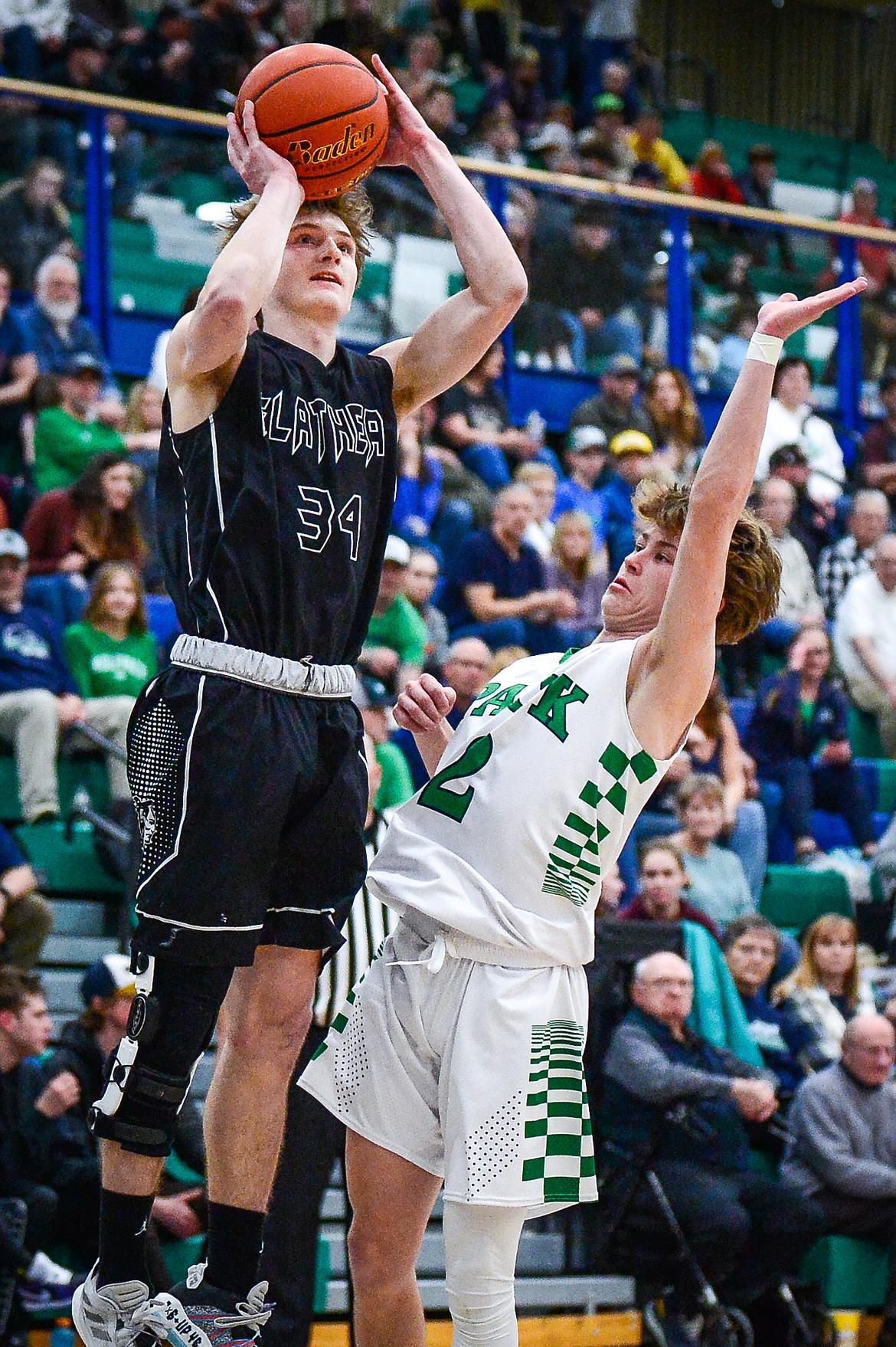 Flathead's Joston Cripe (34) looks to shoot guarded by Glacier's Connor Sullivan (2) at Glacier High School on Thursday, Feb. 17. (Casey Kreider/Daily Inter Lake)