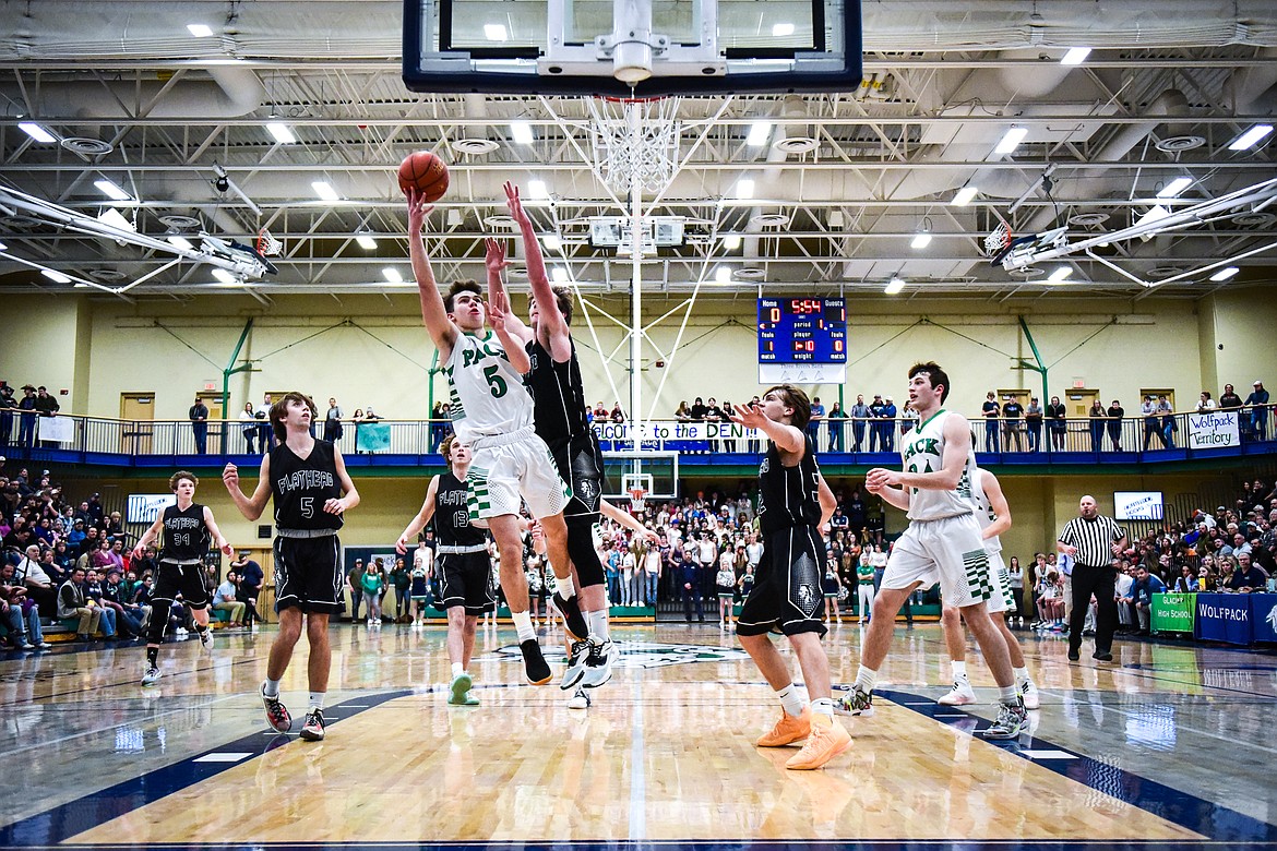 Glacier's Ty Olsen (5) drives to the basket against Flathead at Glacier High School on Thursday, Feb. 17. (Casey Kreider/Daily Inter Lake)