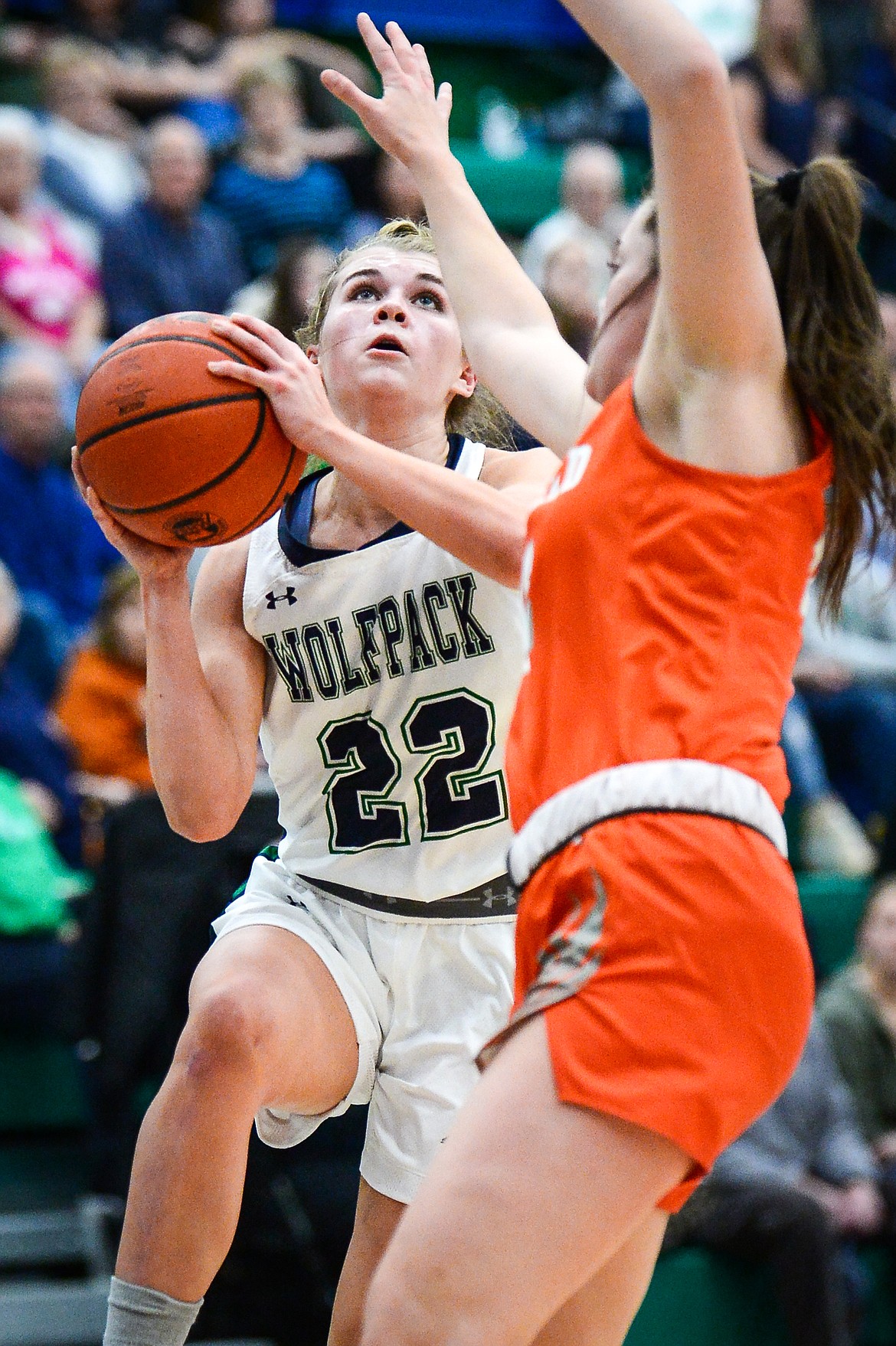 Glacier's Noah Fincher (22) drives to the basket against Flathead's Avery Chouinard (13) at Glacier High School on Thursday, Feb. 17. (Casey Kreider/Daily Inter Lake)