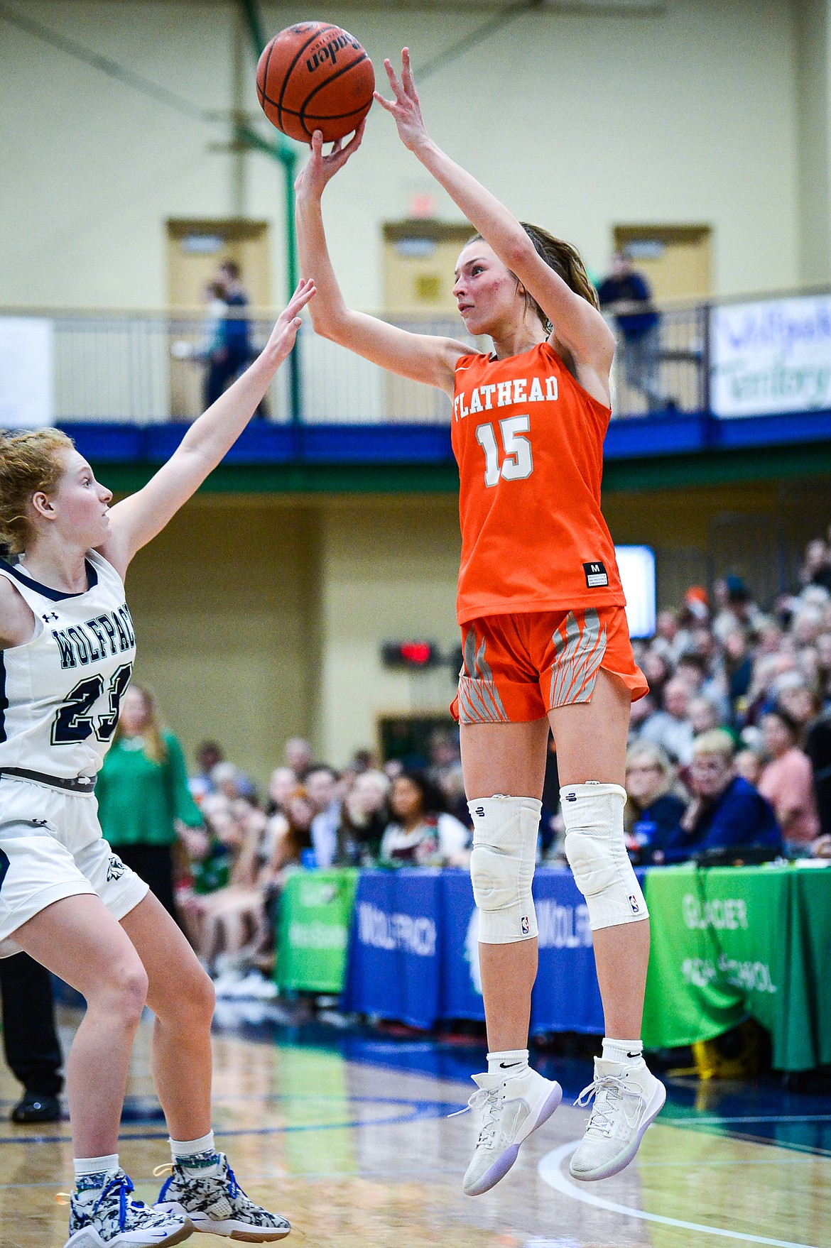 Flathead's Clare Converse (15) sinks a three in the fourth quarter guarded by Glacier's Reese Ramey (23) at Glacier High School on Thursday, Feb. 17. (Casey Kreider/Daily Inter Lake)