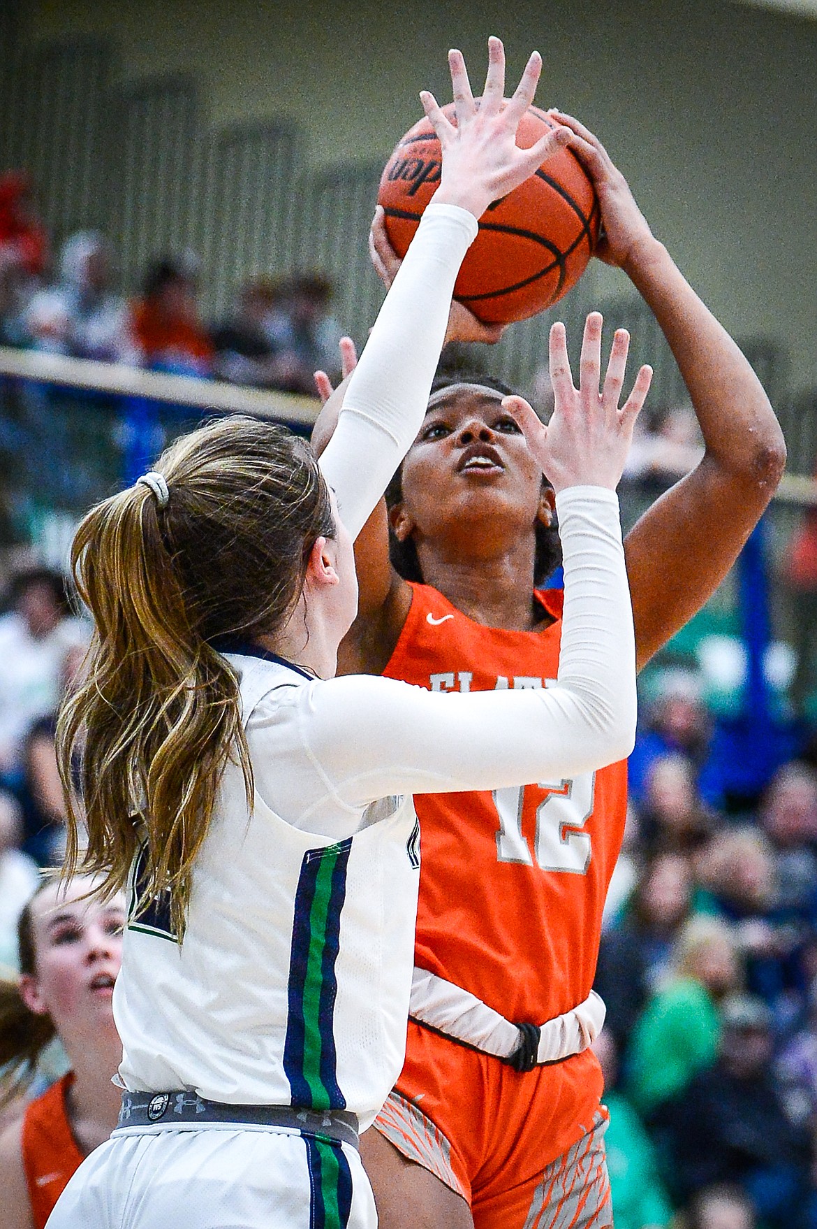 Flathead's Akilah Kubi (12) sinks a bucket defended by Glacier's Sidney Gulick (2) at Glacier High School on Thursday, Feb. 17. (Casey Kreider/Daily Inter Lake)