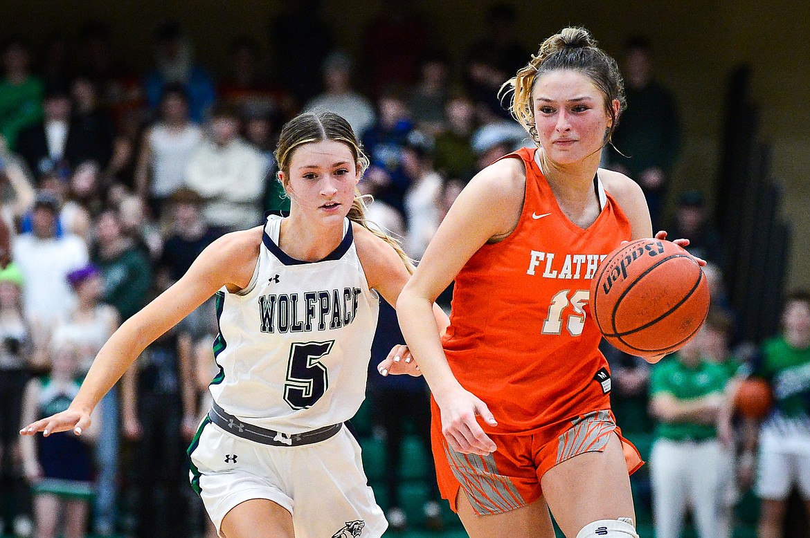 Flathead's Clare Converse (15) pushes the ball upcourt in the fourth quarter guarded by Glacier's Kiera Sullivan (5) at Glacier High School on Thursday, Feb. 17. (Casey Kreider/Daily Inter Lake)