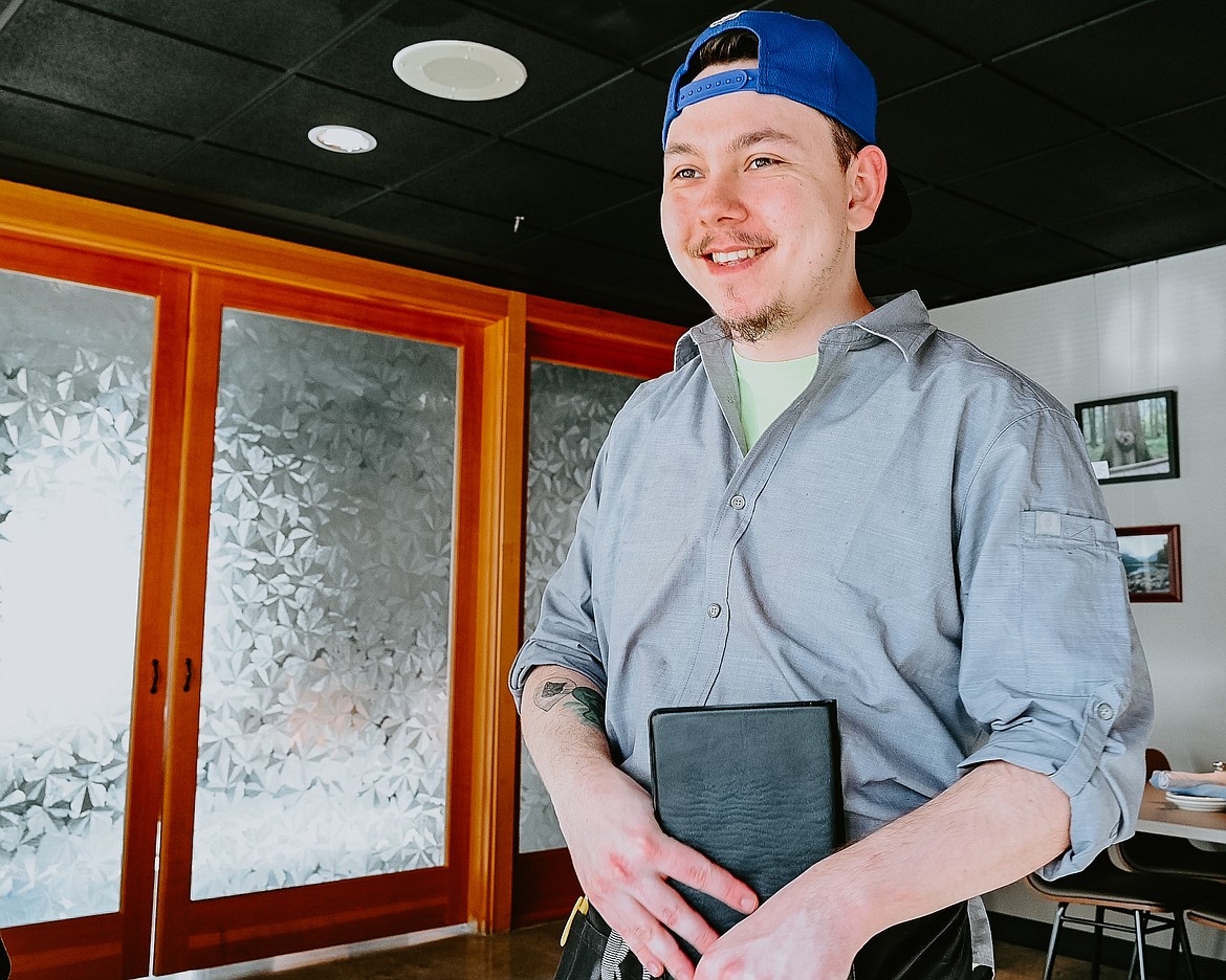 North Idaho College Culinary Arts student Gerhard Werner smiles after taking an order Feb. 10 at Emery’s Restaurant on NIC’s main campus in Coeur d’Alene. Photo courtesy of Elli Oba, North Idaho College