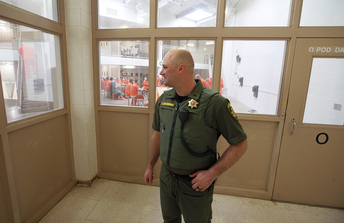 KCSO Lt. Kyle Hutchison stands in a hallway while inmates eat lunch on Thursday.