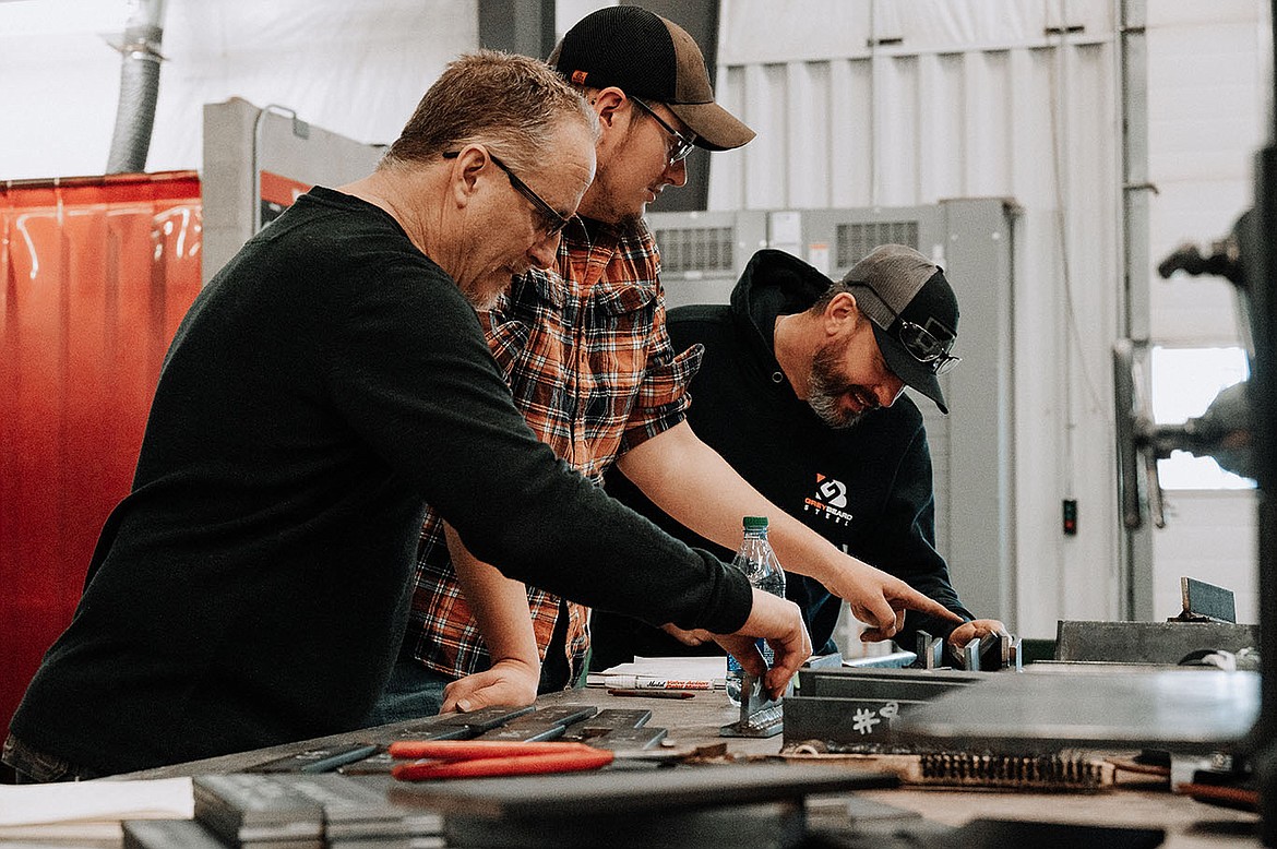 NIC Welding Professor Tim Straw, left, evaluates welds with judges Ryan Brown, center, and Jeremy Brondt during NIC’s annual high school welding competition Feb. 11 at Parker Technical Education Center. Photo courtesy of Elli Oba/North Idaho College
