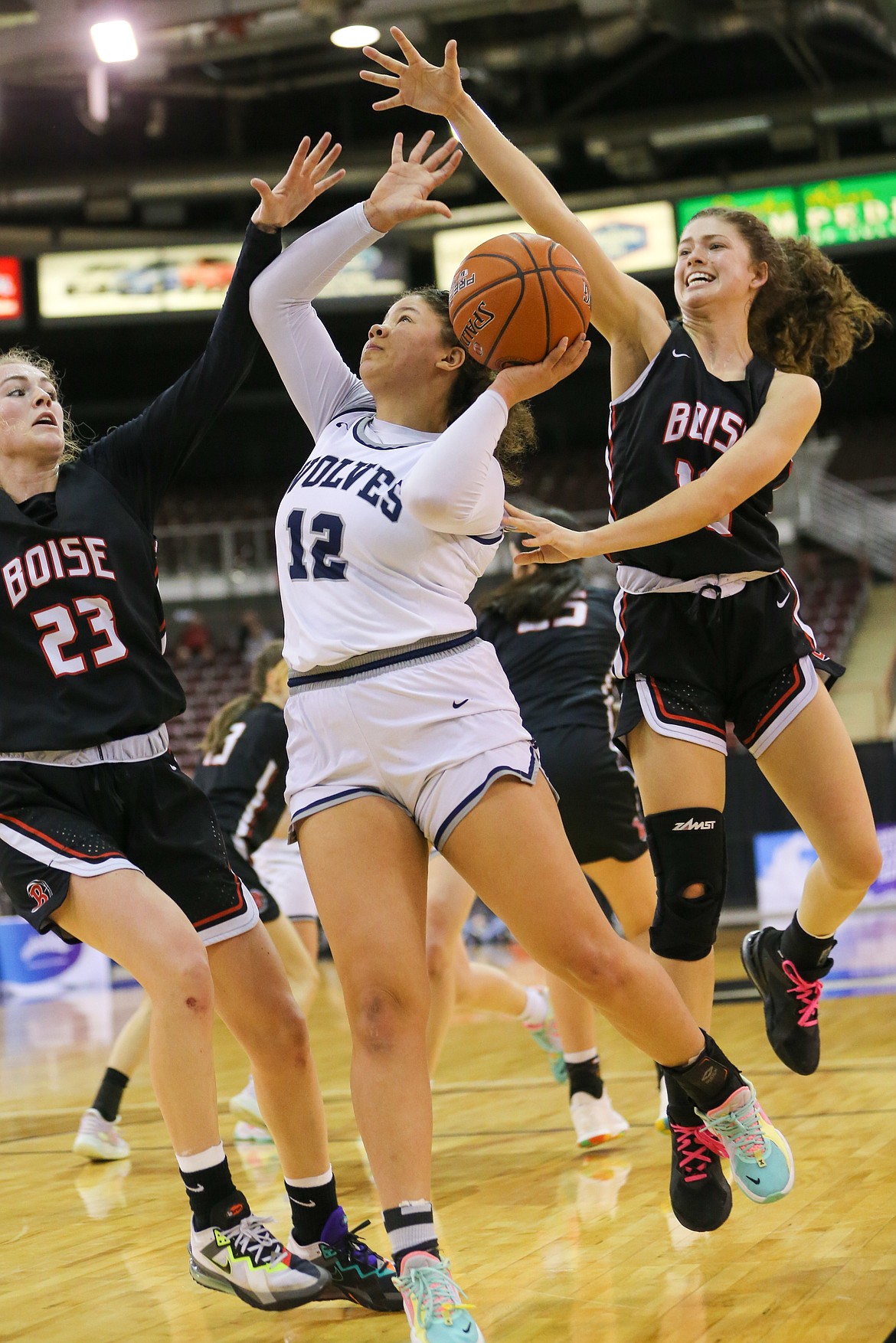 JASON DUCHOW PHOTOGRAPHY
Kursten McKellips (12) of Lake City puts up a shot in traffic against Boise in a state 5A girls basketball semifinal Friday night at the Ford Idaho Center in Nampa.