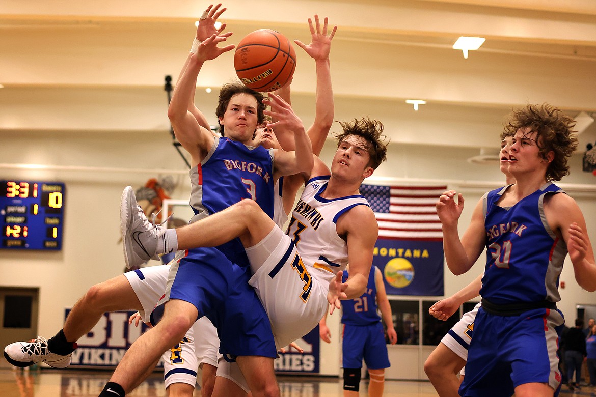 Bigfork’s Isak Epperly and Thompson Falls forward Breck Ferris collide battling for a rebound in the semifinal round of the District 7-B Tournament in Bigfork Friday. (Jeremy Weber/Daily Inter Lake)