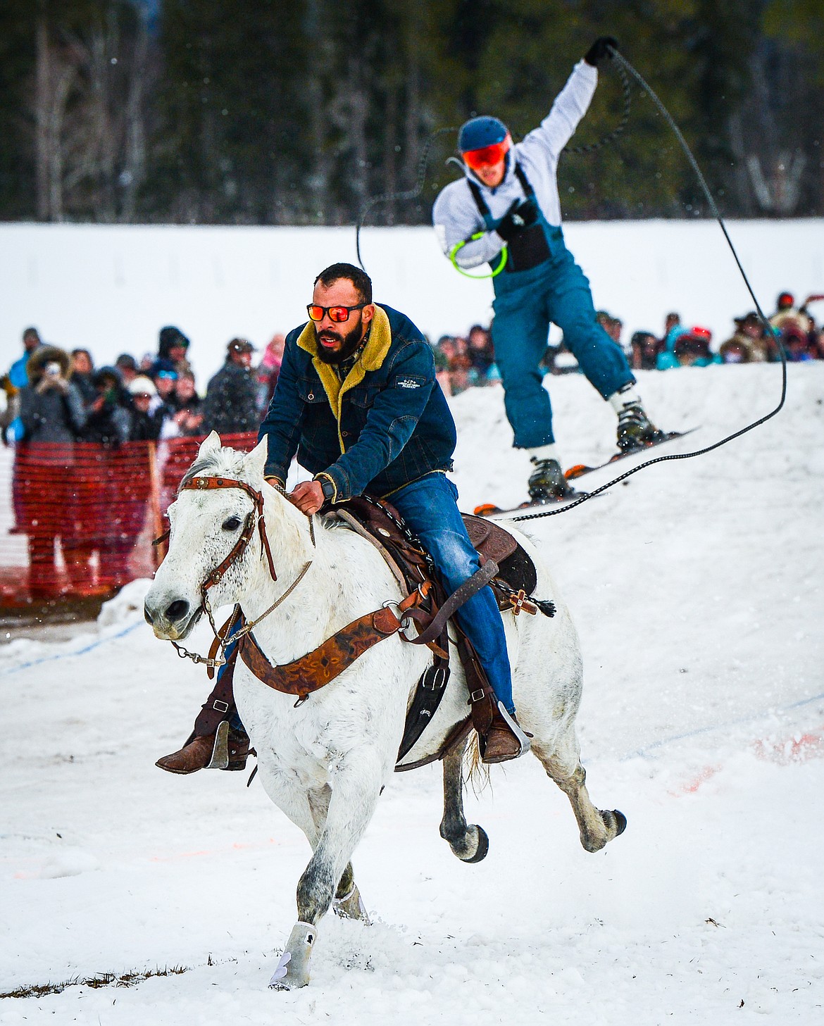 A rider and skier navigate a jump in the course at Whitefish Ski Joring on Saturday, Feb. 19. (Casey Kreider/Daily Inter Lake)