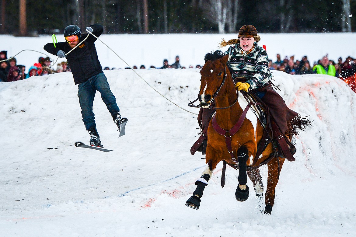 A rider and skier navigate a jump in the course at Whitefish Ski Joring on Saturday, Feb. 19. (Casey Kreider/Daily Inter Lake)