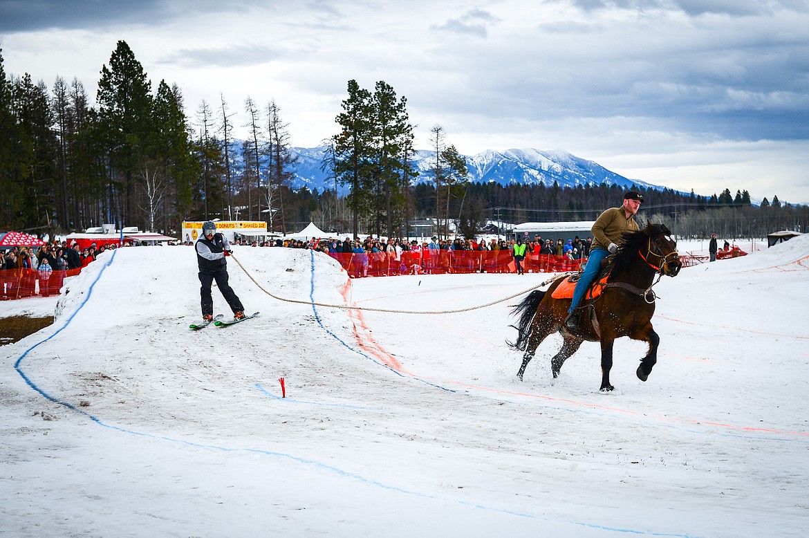A rider and skier navigate the course at Whitefish Ski Joring on Voerman Road in Whitefish on Saturday, Feb. 19. (Casey Kreider/Daily Inter Lake)