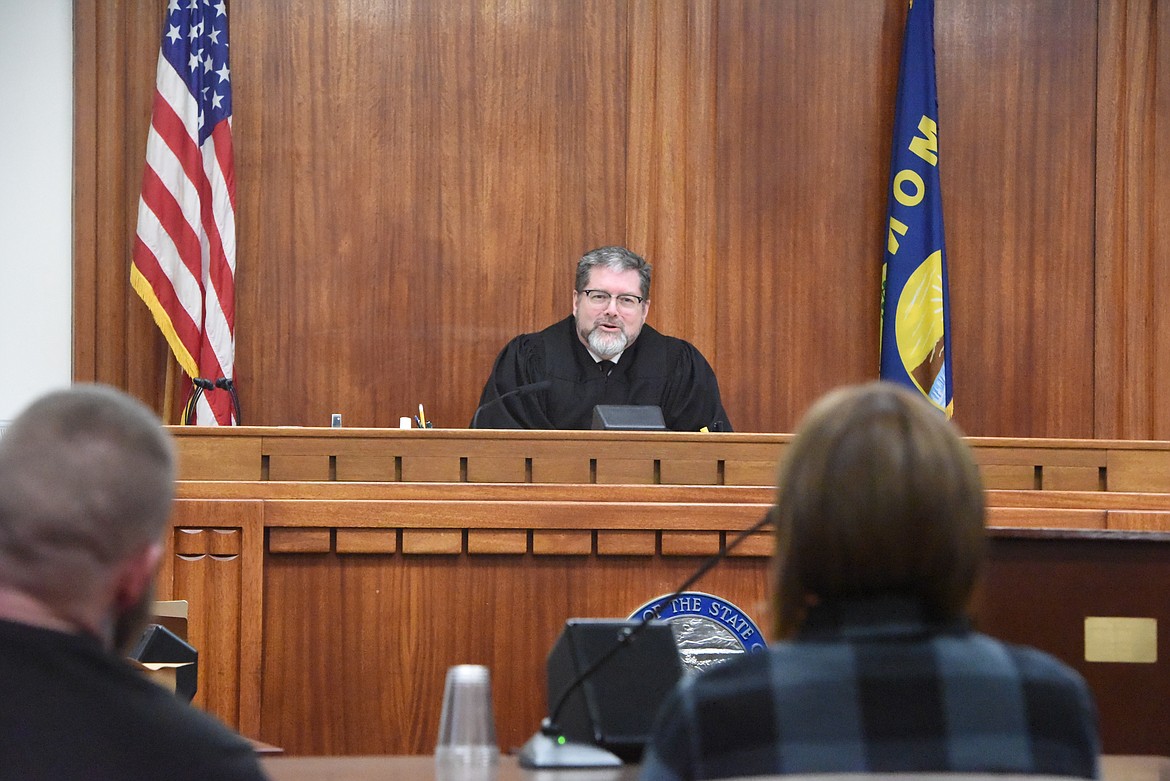District Judge Matthew Cuffe speaks to the three members of Lincoln County Treatment Court's second graduating class on Feb. 18. (Derrick Perkins/The Western News)