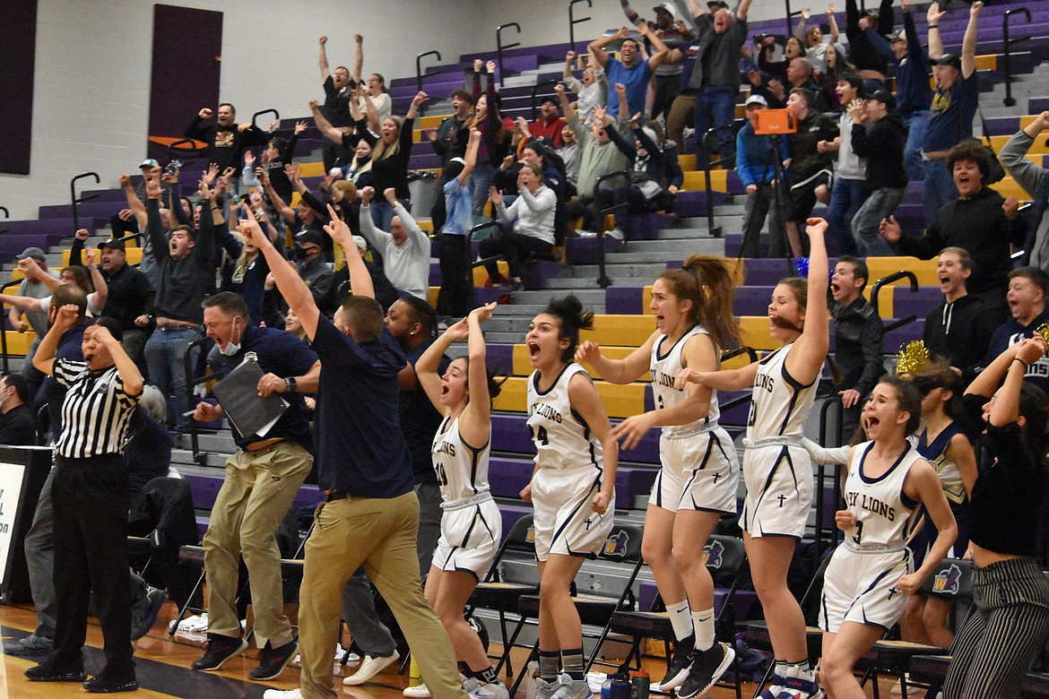 The MLCA/CCS bench and crowd go wild as senior Kali Kast makes a three-point buzzer-beater to win the game on Feb. 17.