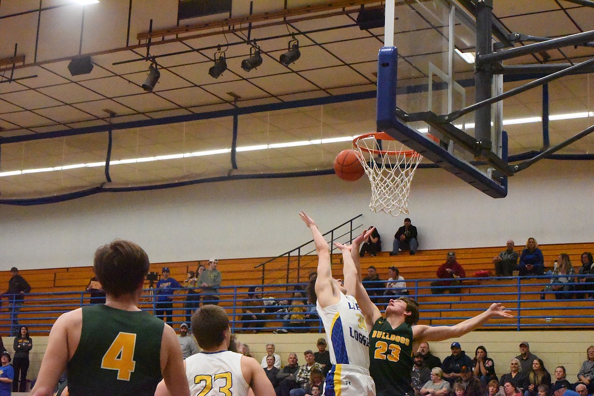 T.J. Andersen goes up for a rebound at a Feb. 18 matchup with the Whitefish Bulldogs. (Derrick Perkins/The Western News)