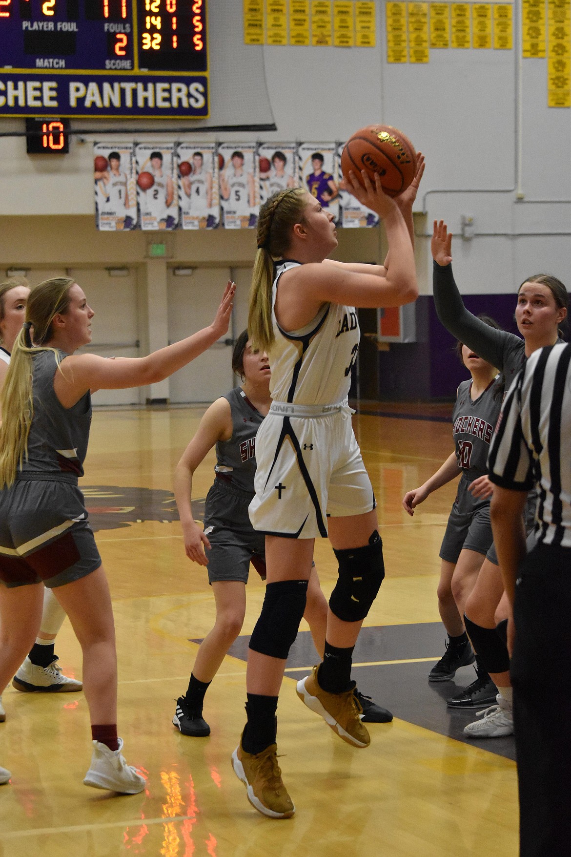 MLCA/CCS junior Kali Kast (33) goes in for a basket during the district title game against Waterville-Mansfield on Feb. 17.