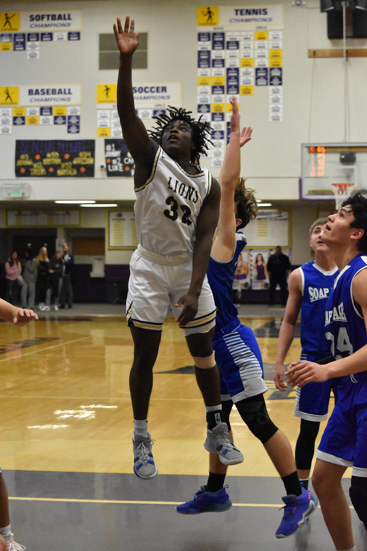 MLCA/CCS senior Pierre Boorman (32) is shown mid-air after shooting the basketball in the district matchup against Soap Lake High School on Feb. 17.