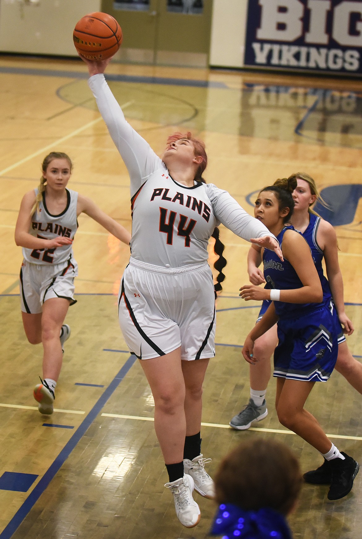 Krystena Boes pulls down a rebound for Plains during action against Mission in the District 7B Tournament in Bigfork Thursday.