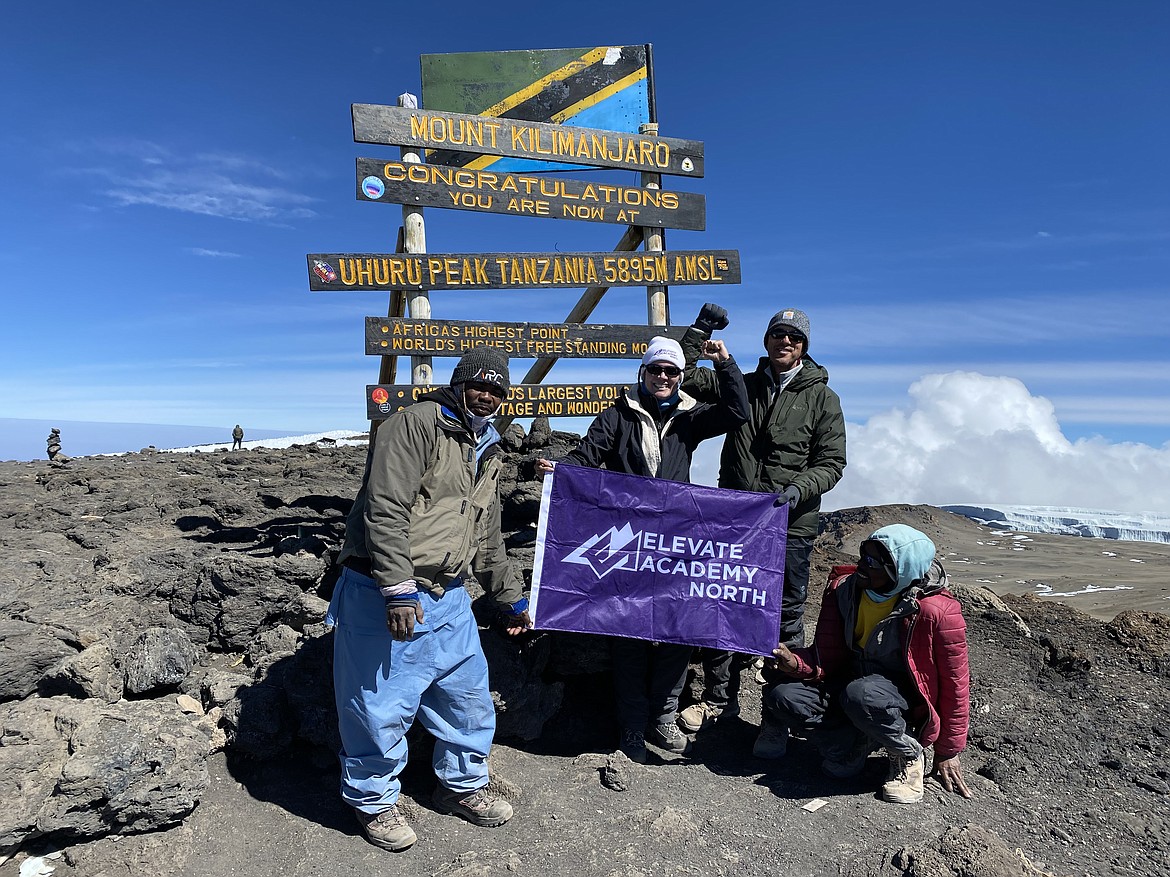 Marita Diffenbaugh, second from left, principal of the new charter school in Post Falls, Elevate Academy North, stands at the top of Mount Kilimanjaro in  Tanzania, Africa, with her husband Andy, third from left. The team included locals from Top Climbers, Mpemba on the far left Lema on the far right. Photo courtesy of Marita Diffenbaugh