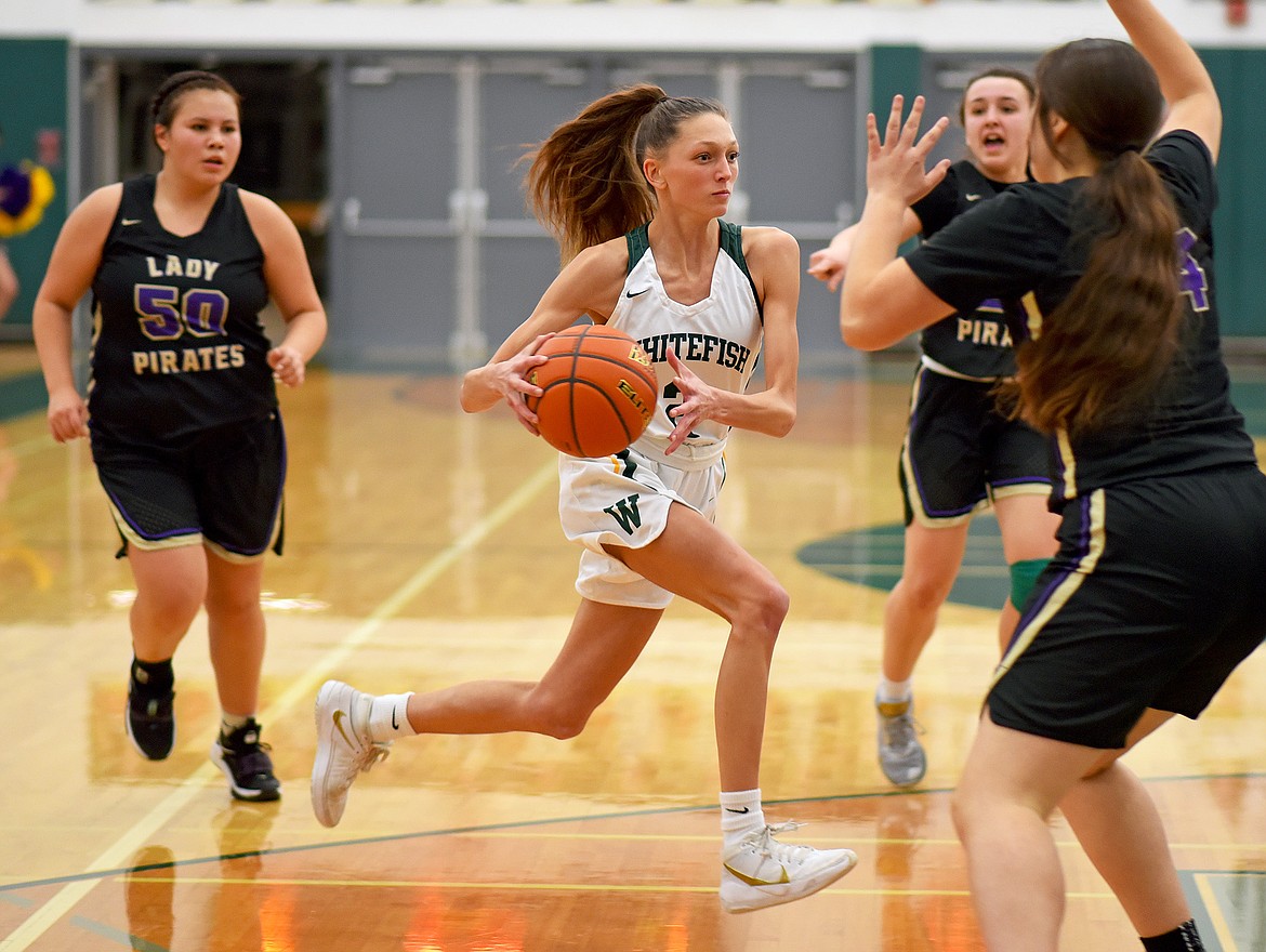 Whitefish senior Erin Wilde drives to the hoop against Polson during a play-in game on Friday at WHS. (Whitney England/Whitefish Pilot)