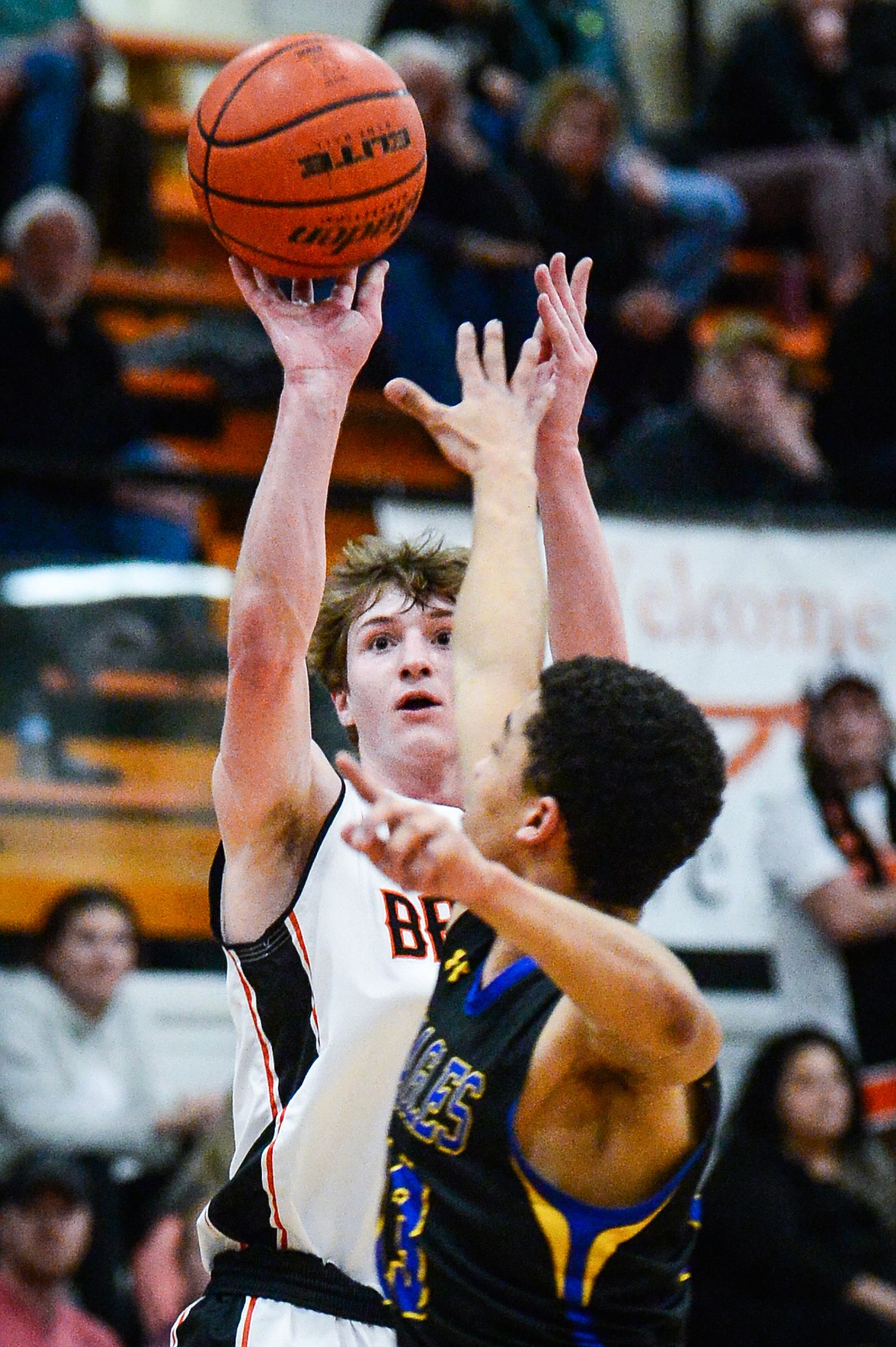 Flathead's Joston Cripe (34) shoots a three guarded by Missoula Big Sky's Louis Sanders (13) at Flathead High School on Tuesday, Feb. 22. (Casey Kreider/Daily Inter Lake)