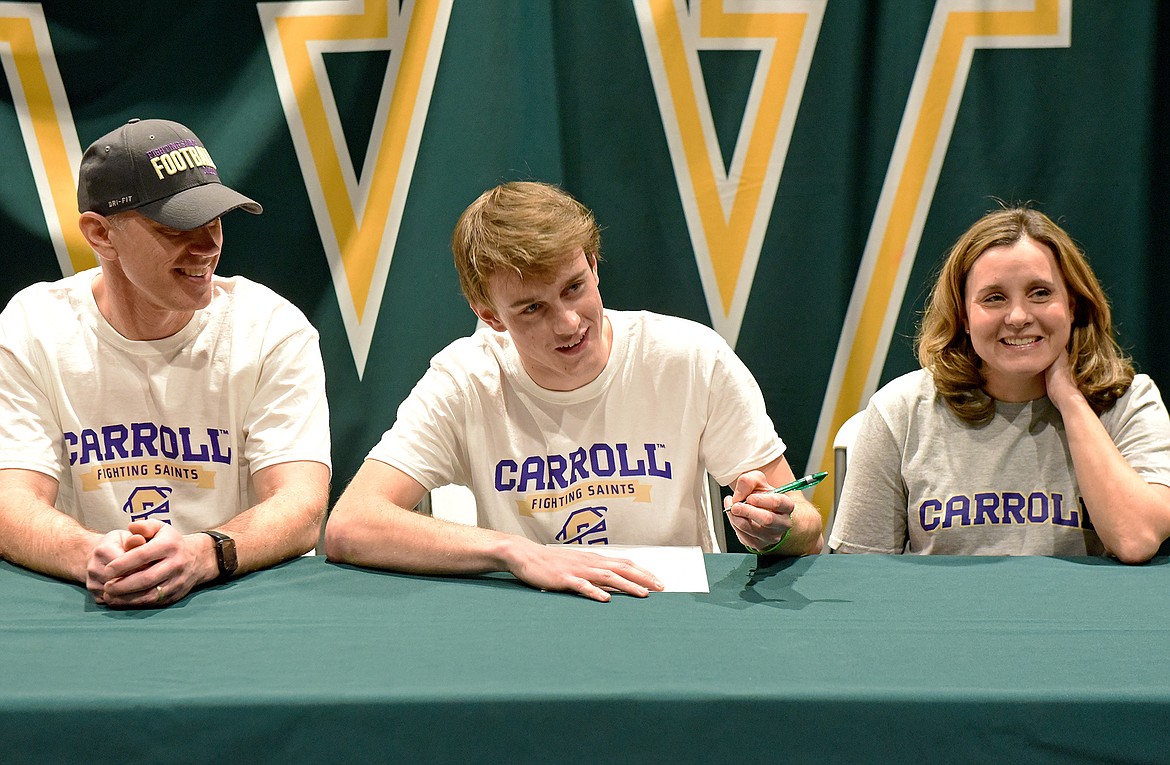 Whitefish's Bodie Smith signs a letter of intent to play football at Carroll College. (Whitney England/Whitefish Pilot)