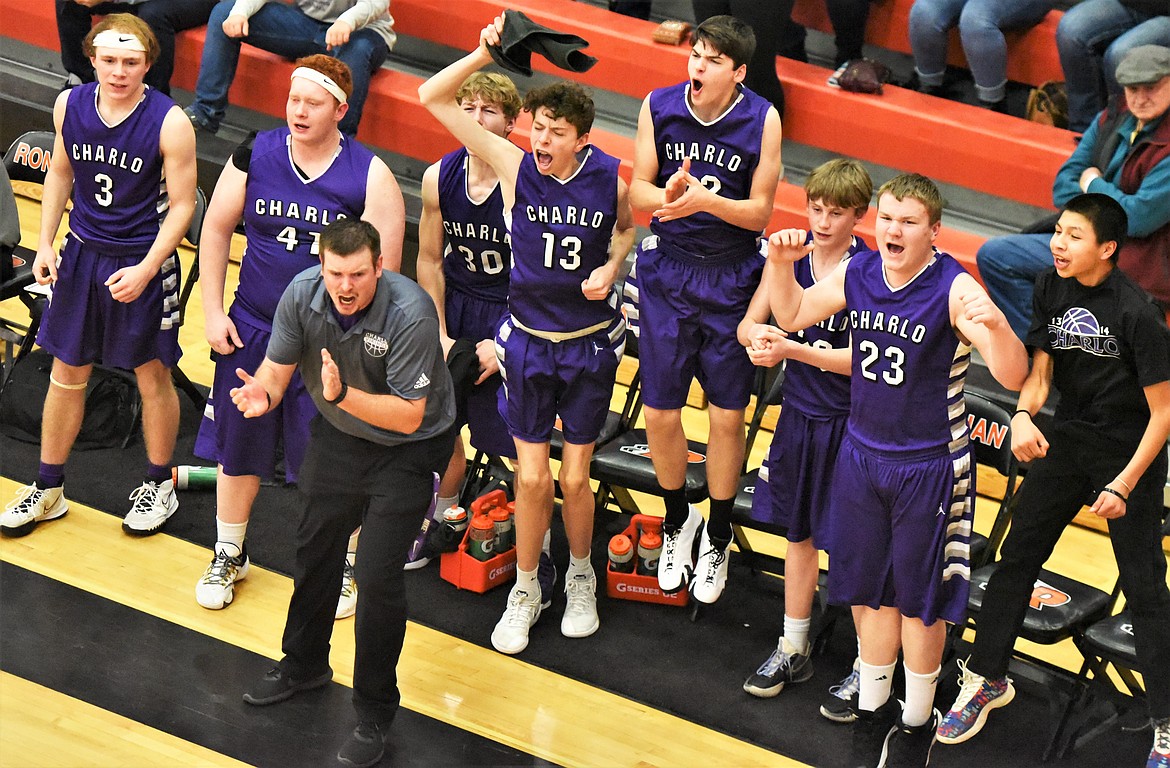 Head coach Reese Cox and the Vikings bench celebrate during their semifinal game Friday against Hot Springs at Ronan. (Scot Heisel/Lake County Leader)