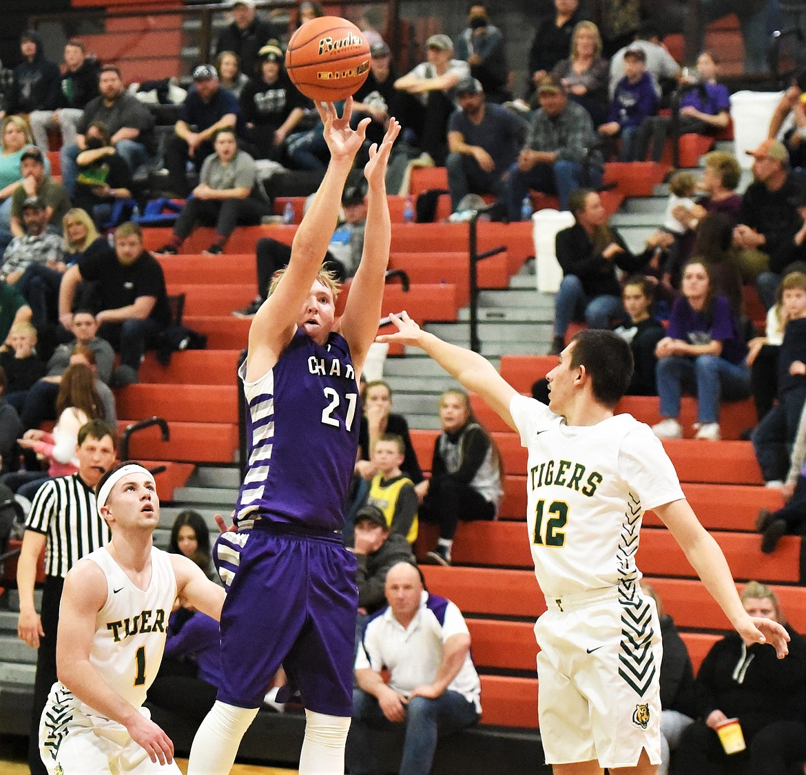 Charlo's Stetson Reum takes a long-range shot during the district title game against St. Regis. (Scot Heisel/Lake County Leader)