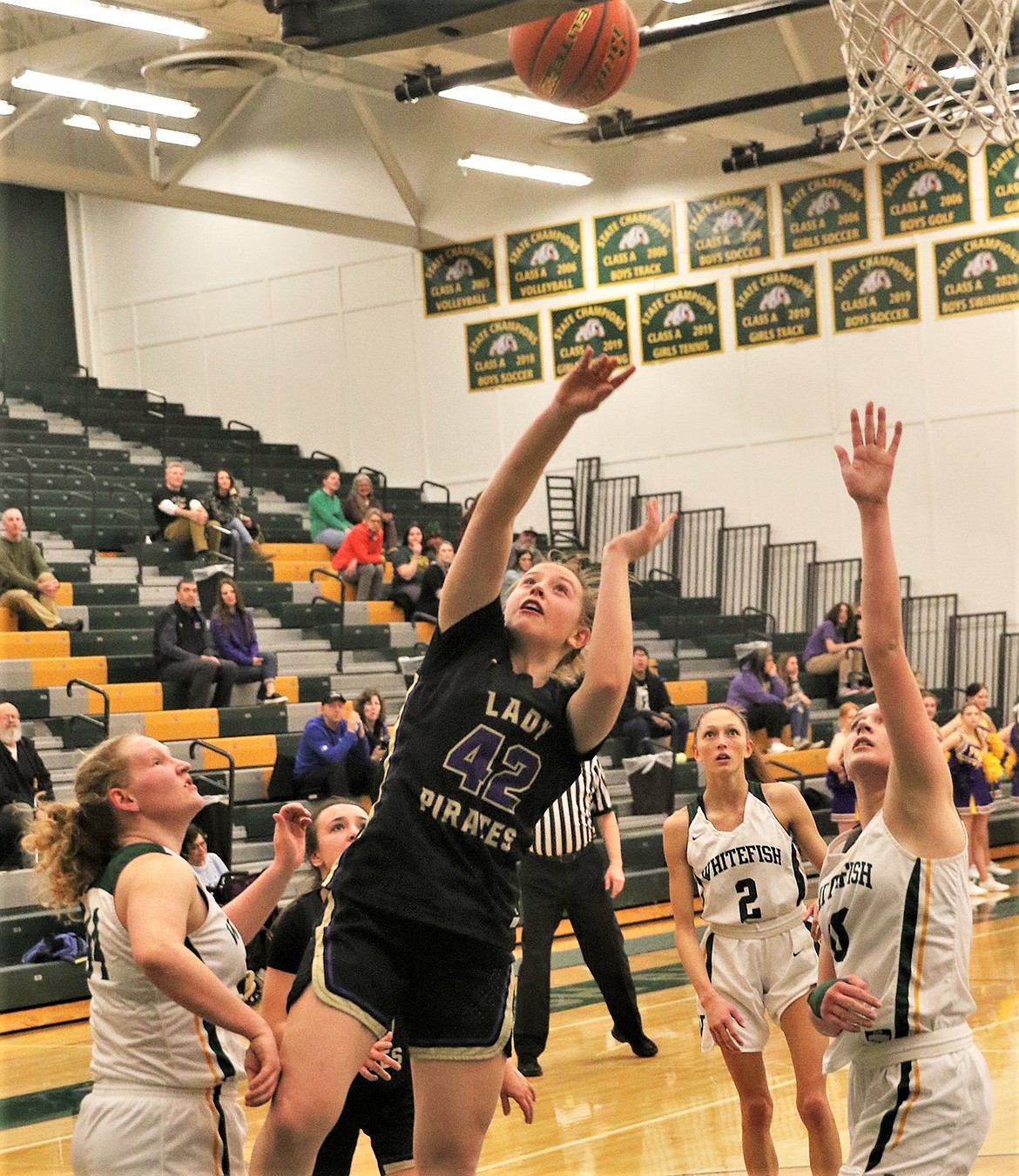 Grace Simonich puts up a shot in the paint during the Lady Pirates' district play-in game at Whitefish. (Courtesy of Bob Gunderson)