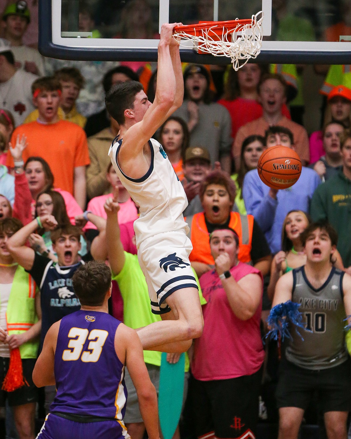 JASON DUCHOW PHOTOGRAPHY
Lake City students react as Blake Buchanan dunks during the Timberwolves' victory over Lewiston in the 5A Region 1 boys basketball championship game Tuesday night at Lake City.