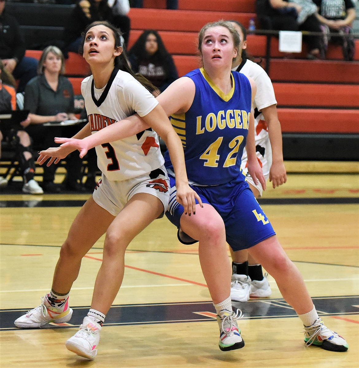 Ronan's Leina Ulutoa vies for a rebound with Libby's Taylor Munro. (Scot Heisel/Lake County Leader)