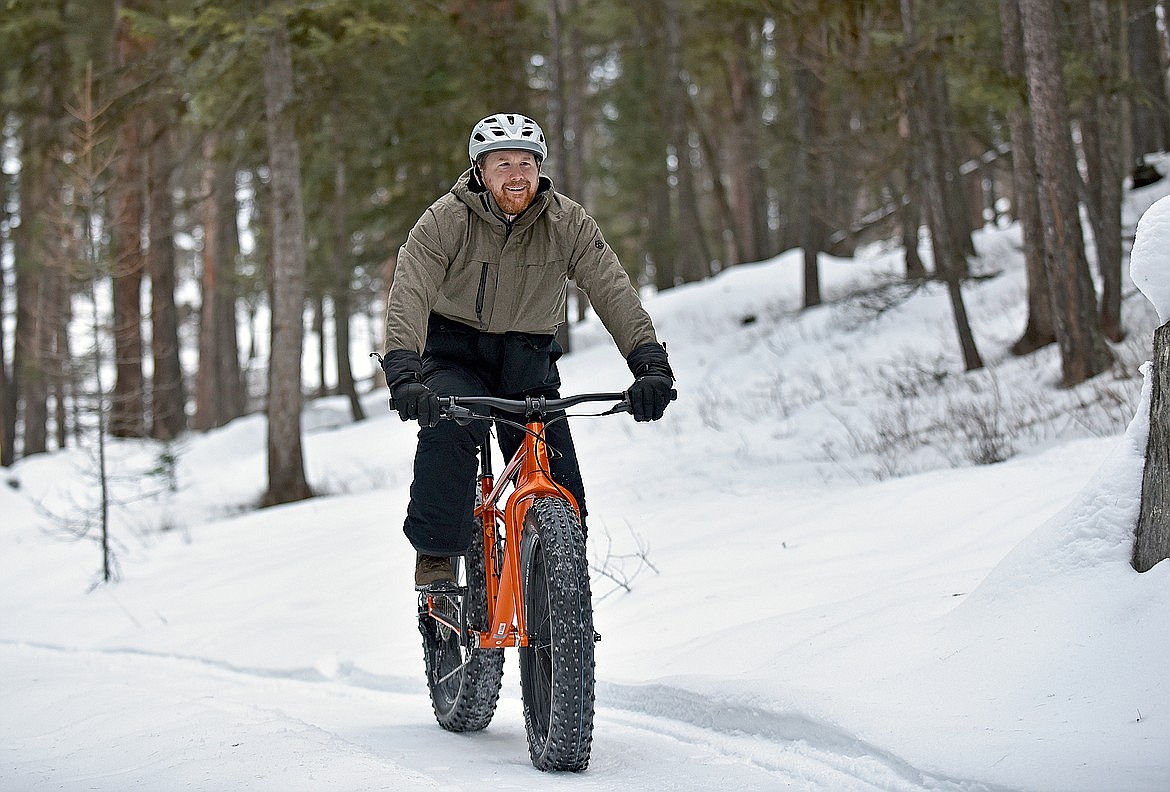 Andrew Sidesinger rides a fat bike on the Whitefish Trail near Beaver Lakes, which is now groomed by the Whitefish Bike Retreat staff for public recreation use. (Whitney England/Whitefish Pilot)