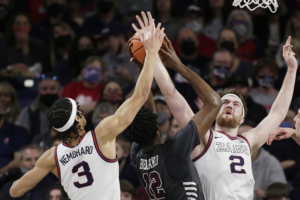 YOUNG KWAK/Associated Press
Gonzaga guard Andrew Nembhard (3), forward Drew Timme (2) and Santa Clara center Jaden Bediako (12) go after a rebound during the second half of Saturday's game in Spokane.