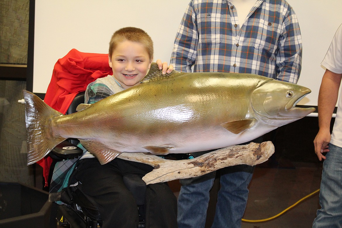 Alex Reister received the trophy commemorating his catch during the 2018 Youth Outdoors Unlimited banquet in Moses Lake. Some of the successful YOU hunters and fishermen will receive their trophies at the Moses Lake YOU banquet, to be held March 5.