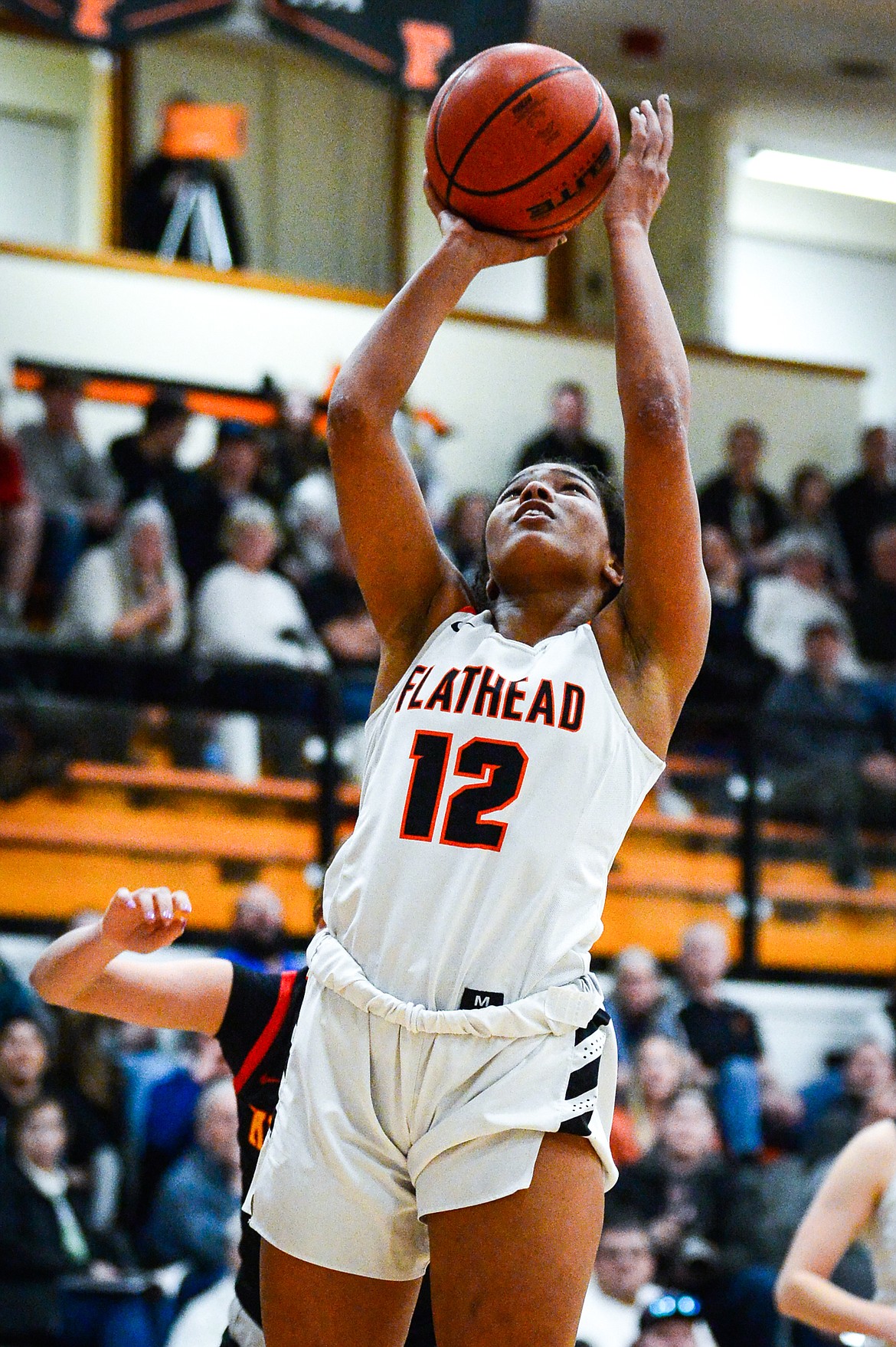 Flathead's Akilah Kubi (12) goes to the basket against Missoula Hellgate at Flathead High School on Thursday, Feb. 24. (Casey Kreider/Daily Inter Lake)