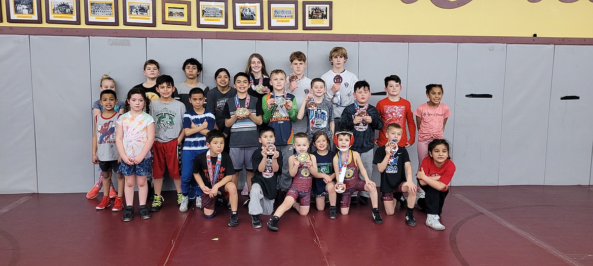 Moses Lake Wrestling Club members pose with their medals after participating in the Washington State Wrestling Association Folkstyle Championship at the Tacoma Dome on Feb. 20.