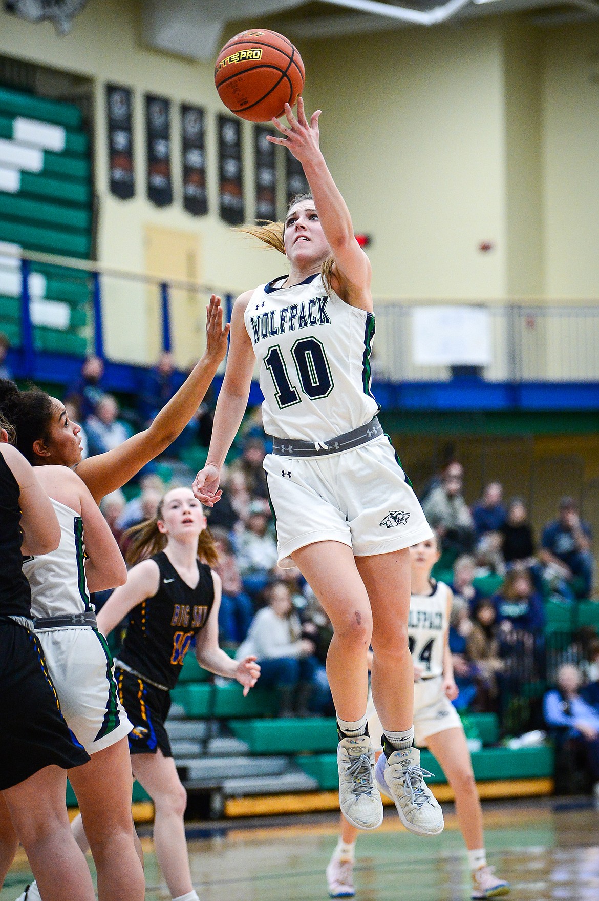 Glacier's Bethany Sorensen (10 drives to the basket against Missoula Big Sky at Glacier High School on Friday, Feb. 25. (Casey Kreider/Daily Inter Lake)