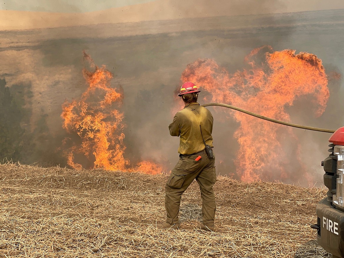 A firefighter works on the Leland Complex wildfire on the Idaho Department of Lands Ponderosa Forest Protective District, started by lightning on July 7. Photo courtesy of the Idaho Department of Lands