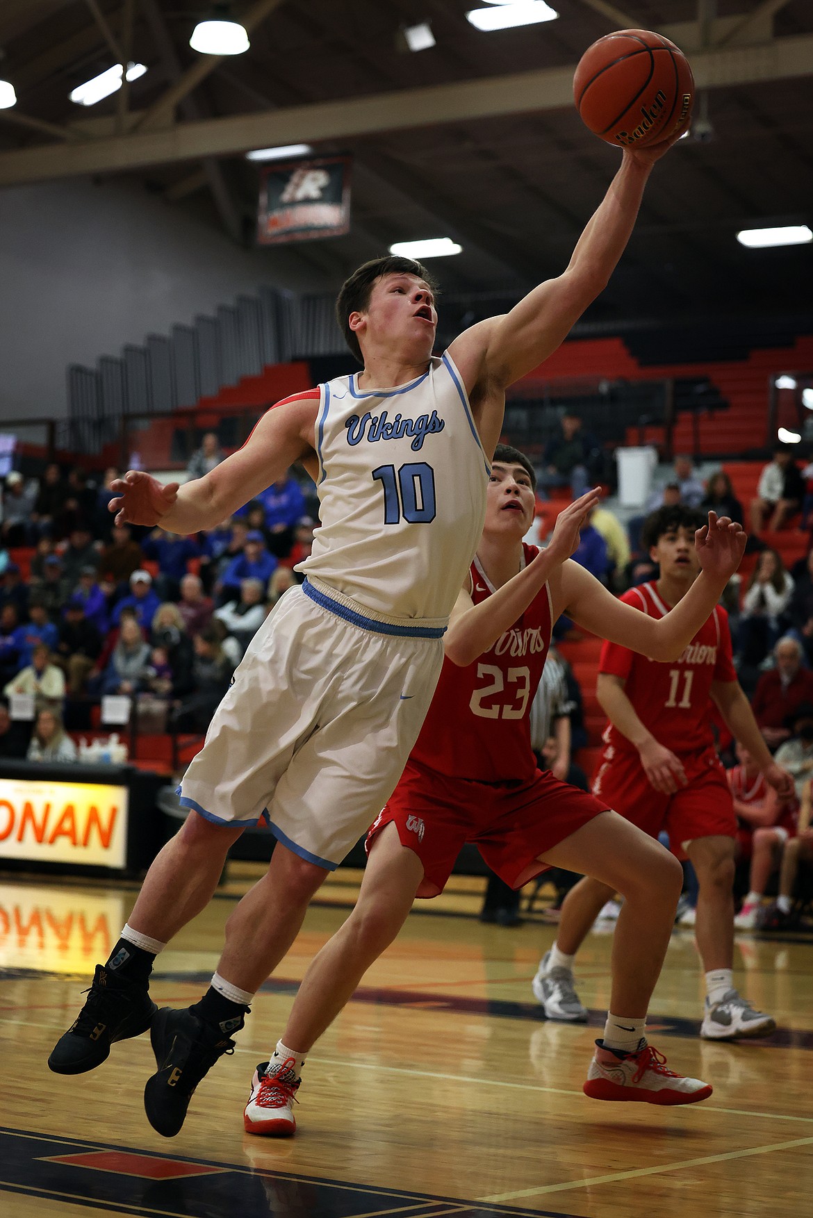 Bigfork's Levi Taylor pulls in a one-handed rebound against Arlee during first round action at the Western B Divisional Tournament in Ronan on Thursday, Feb. 24. (Jeremy Weber/Daily Inter Lake)