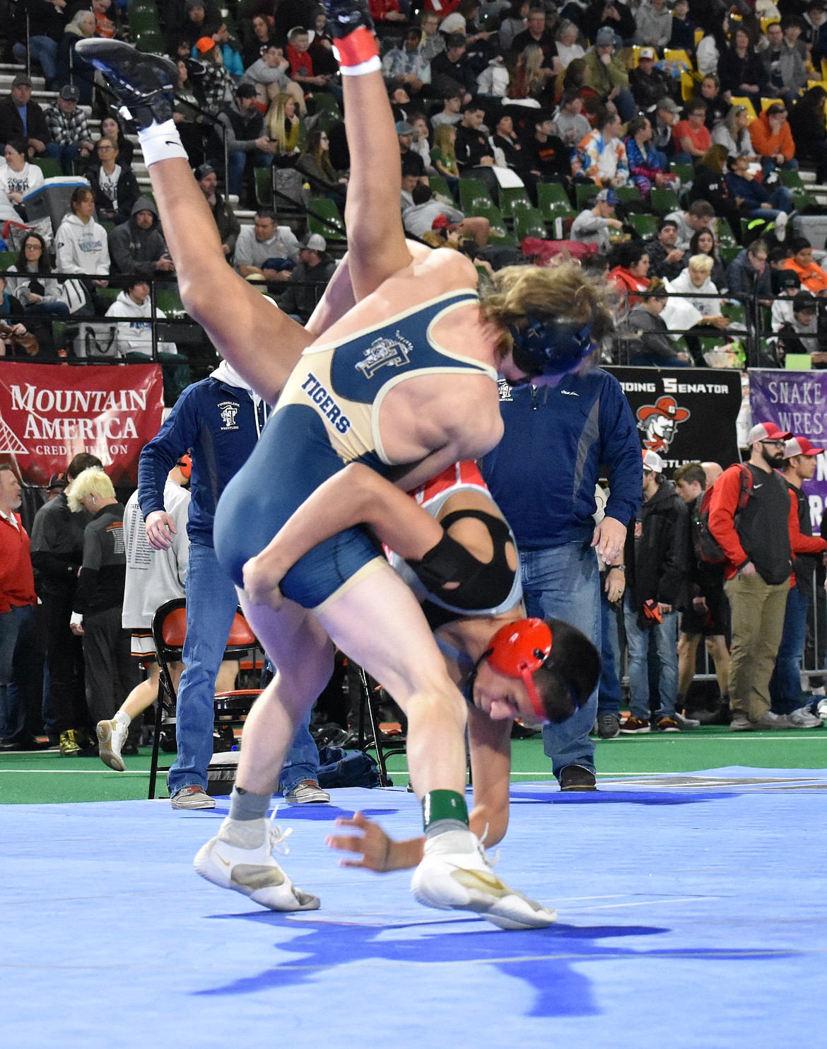 Photo by MOLLY MASON
Stryker Huston, left, of Timberlake, won two matches Friday and advanced to the 3A semifinals at 120 pounds at the state high school wrestling tournaments at Holt Arena in Pocatello.
