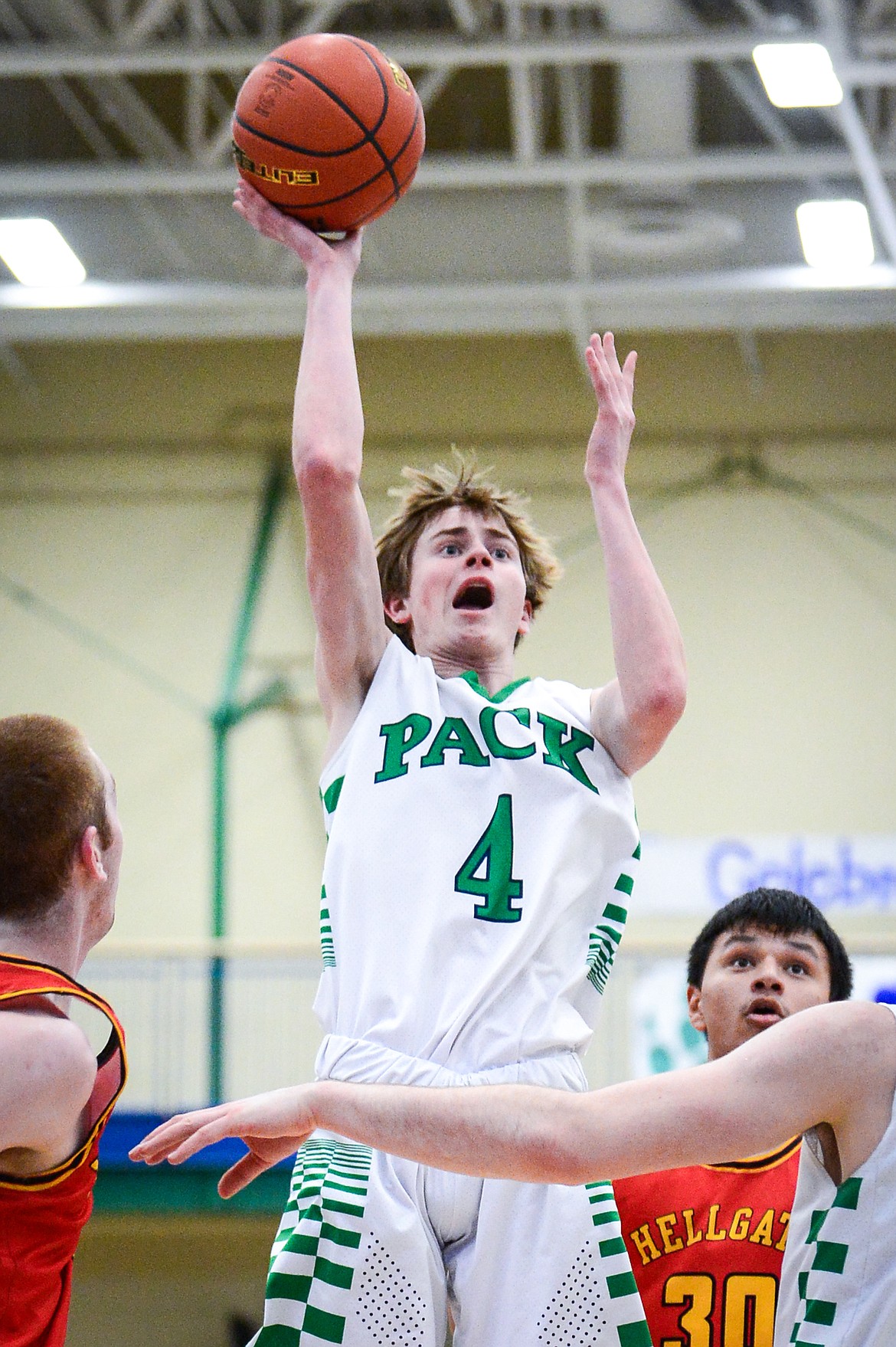 Glacier's Tyler McDonald (4) drives into the lane for a shot against Missoula Hellgate at Glacier High School on Saturday, Feb. 26. (Casey Kreider/Daily Inter Lake)