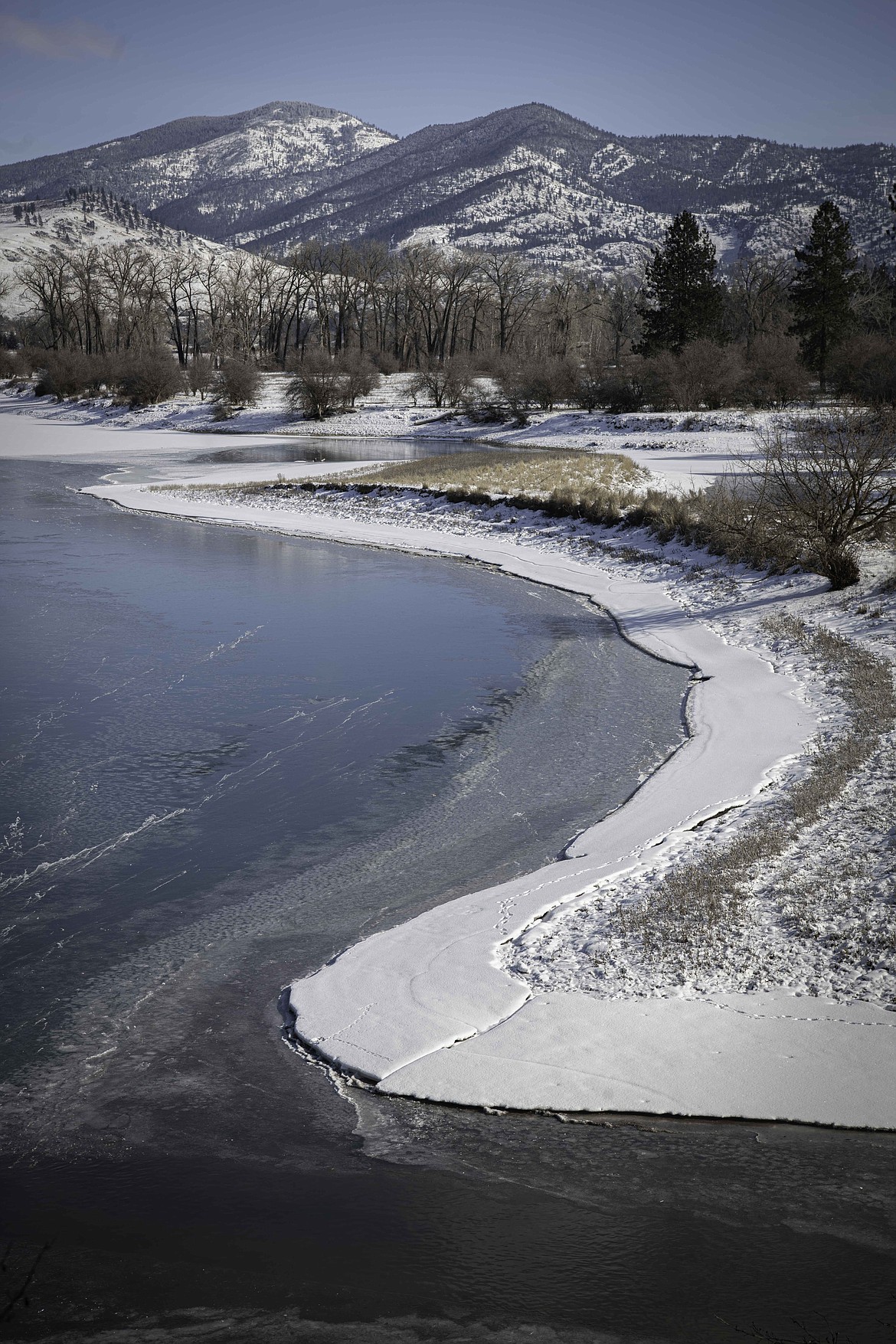 Ice builds up along the shore of the Clark Fork River in Sanders County. (Tracy Scott/Valley Press)