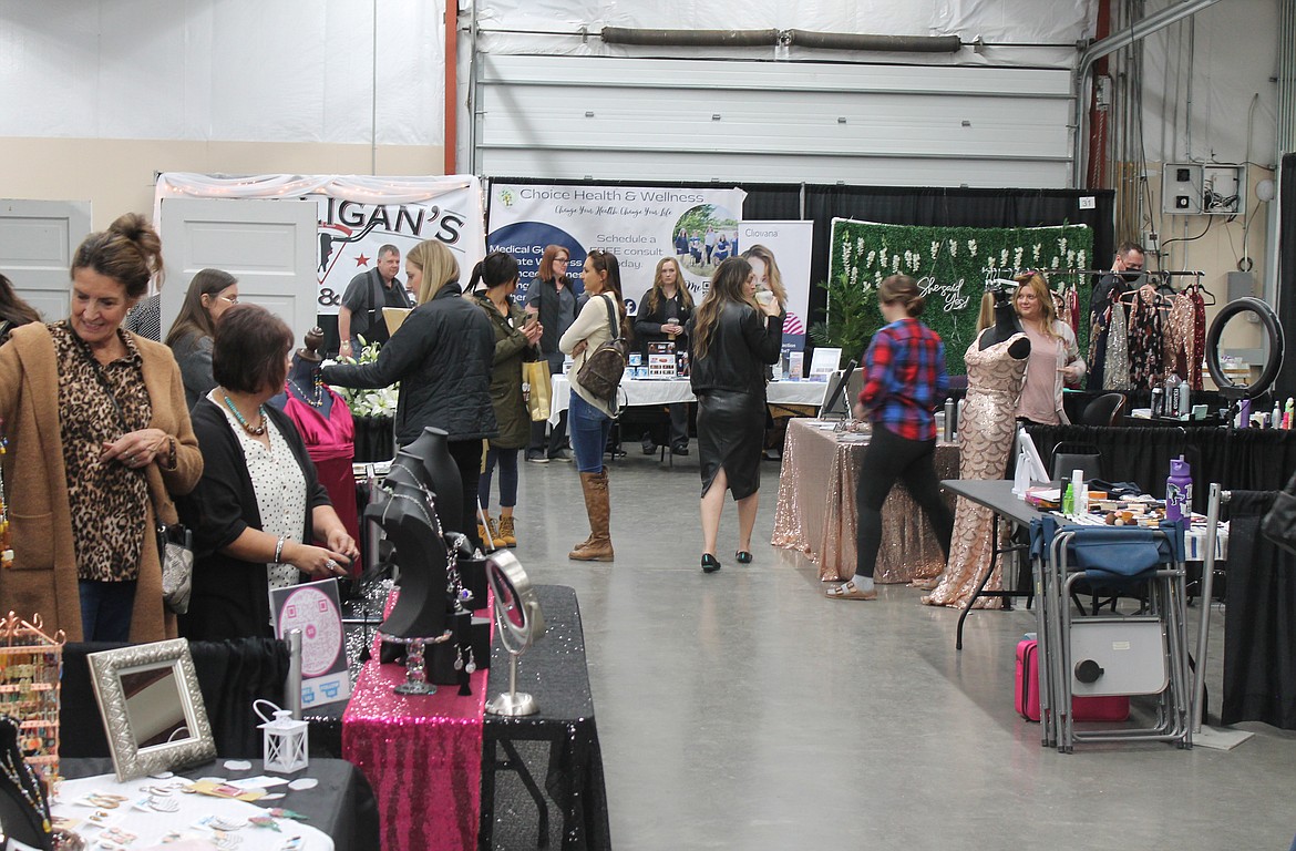 Attendees browse the offerings at the Enchanting Bridal Show at the Grant County Fairgrounds Saturday.