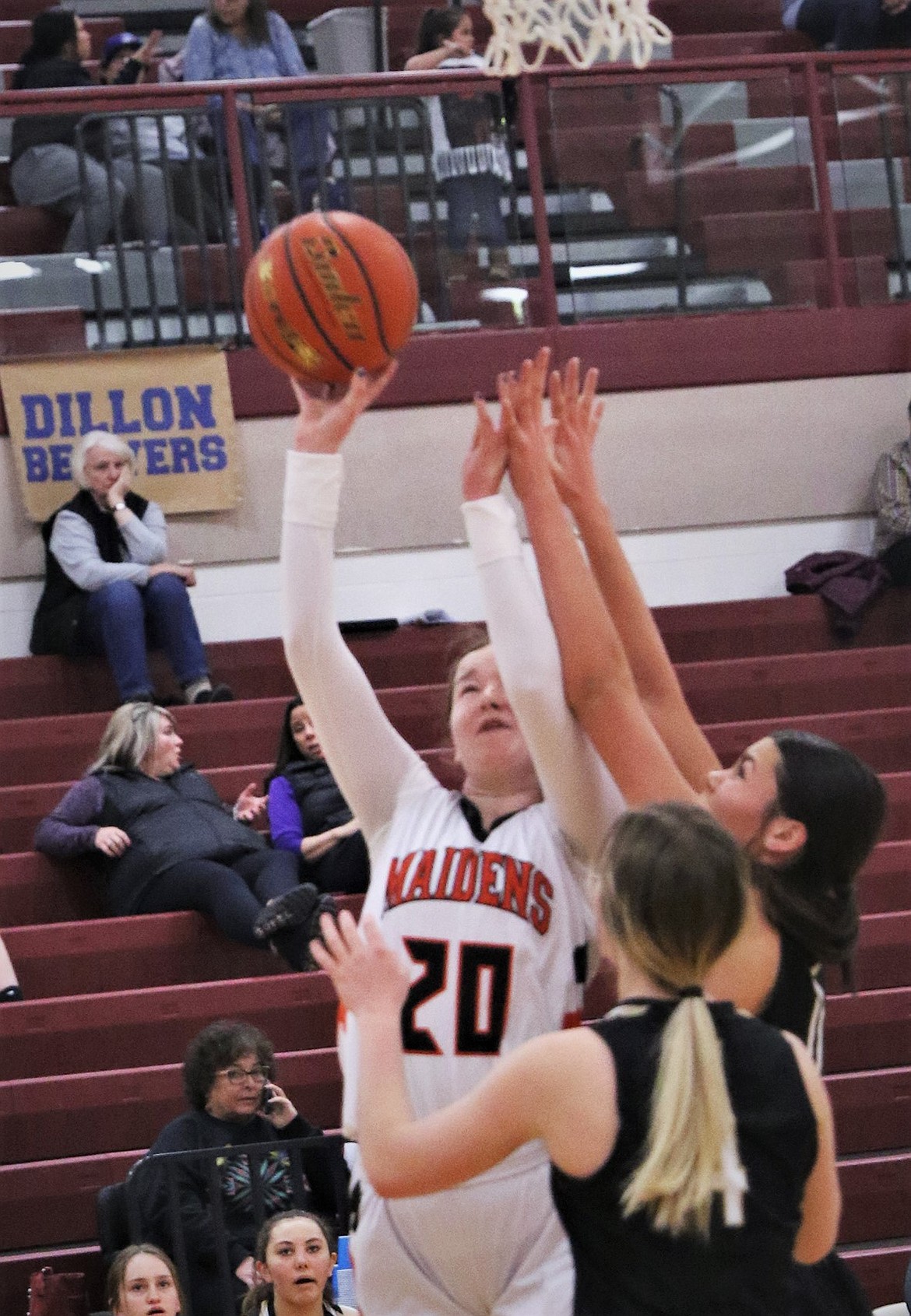 Ronan's Dani Coffman tries to shoot in traffic against Stevensville. (Courtesy of Bob Gunderson)