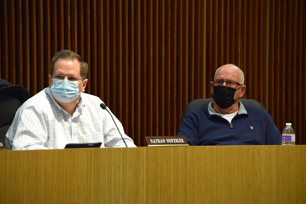 Moses Lake Planning Commission members Nathan Nofziger and Gary Mann listen during a meeting Thursday to discuss revising the city’s Shoreline Master Plan.