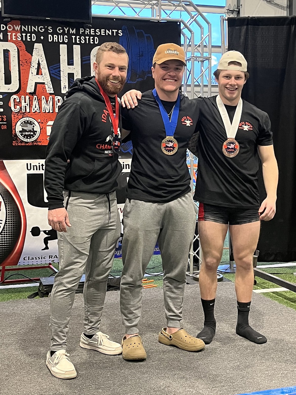 Levi Balison (right), poses after shattering three state records following the Idaho State Championships powerlifting event at the Rock and Armor Gym in Meridian. Pictured, from left, are Calum Webb, Jared Brenden, and Bailson.