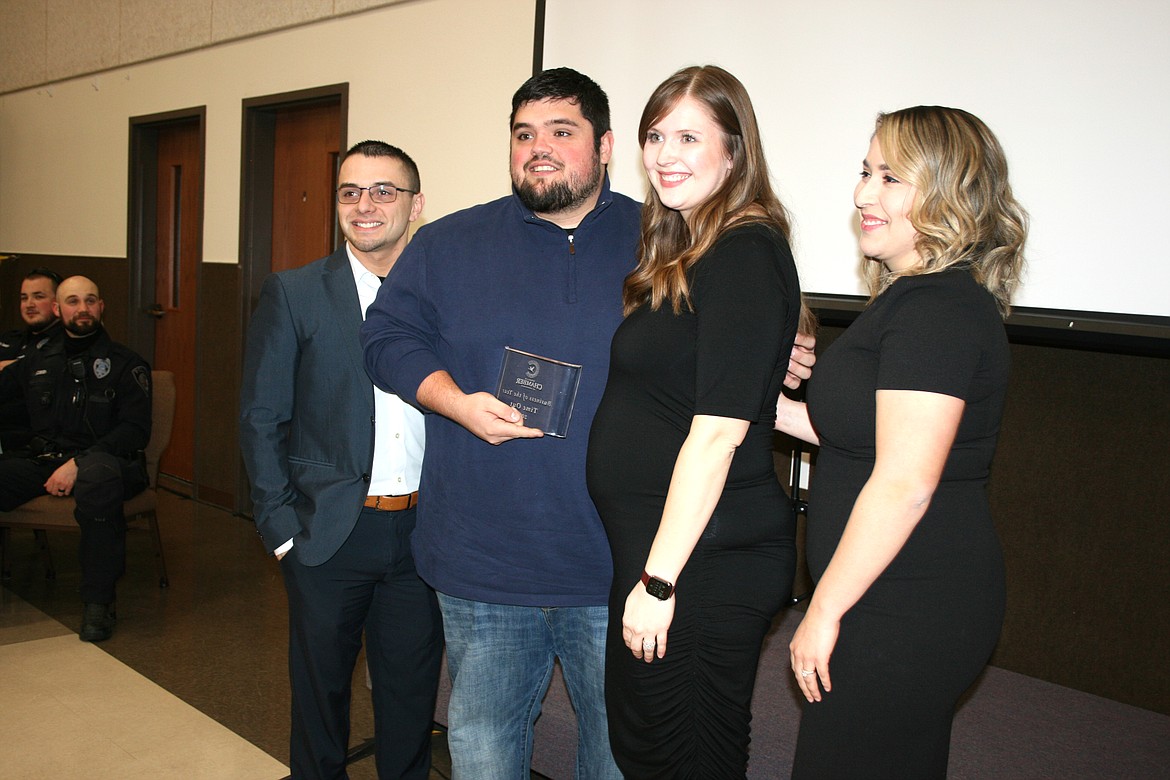CJ and Carli Garza (center), owners of Time Out Pizza in Othello, received the Business of the Year award at the Othello Chamber of Commerce banquet Friday. The award was presented by 2022 Chamber president Mat Garza (left) and 2023 president Thalia Lemus (right).