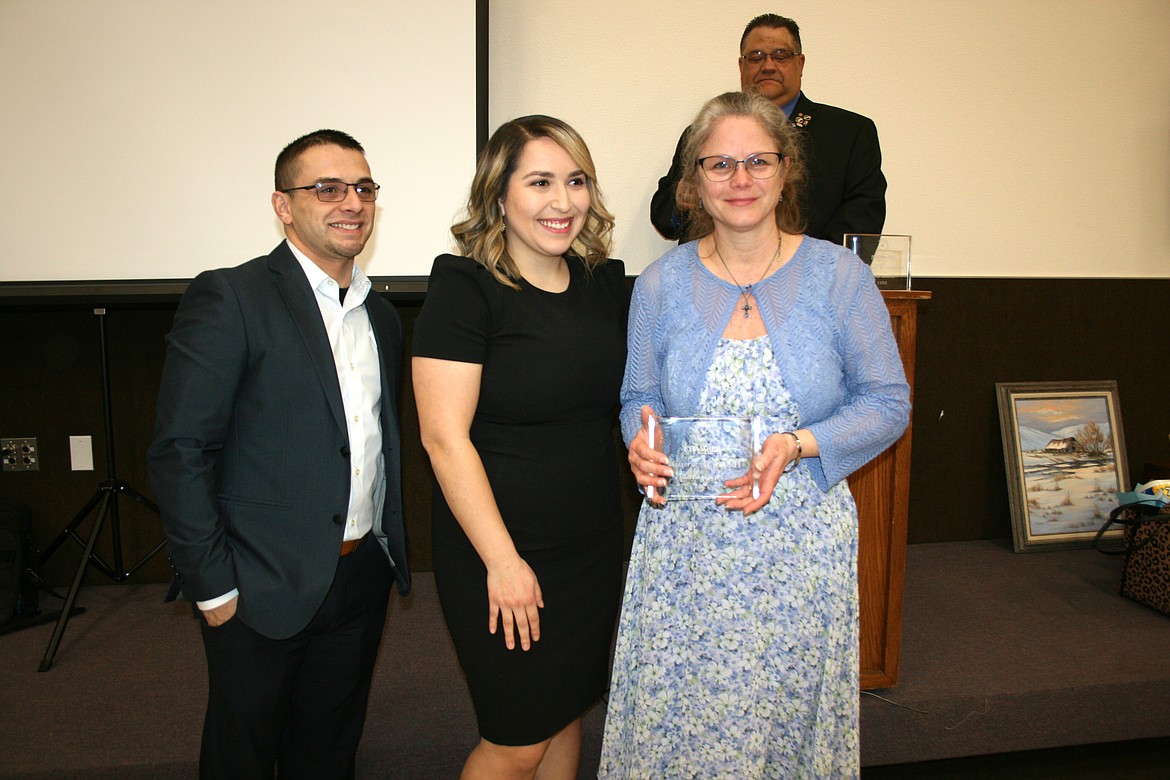 Othello High School teacher Tonya Lewis (right) was recognized as 6-12 Teacher of the Year at the Othello Chamber banquet Friday. The award was presented by 2022 Chamber president Mat Garza (left) and 2023 president Thalia Lemus (center).