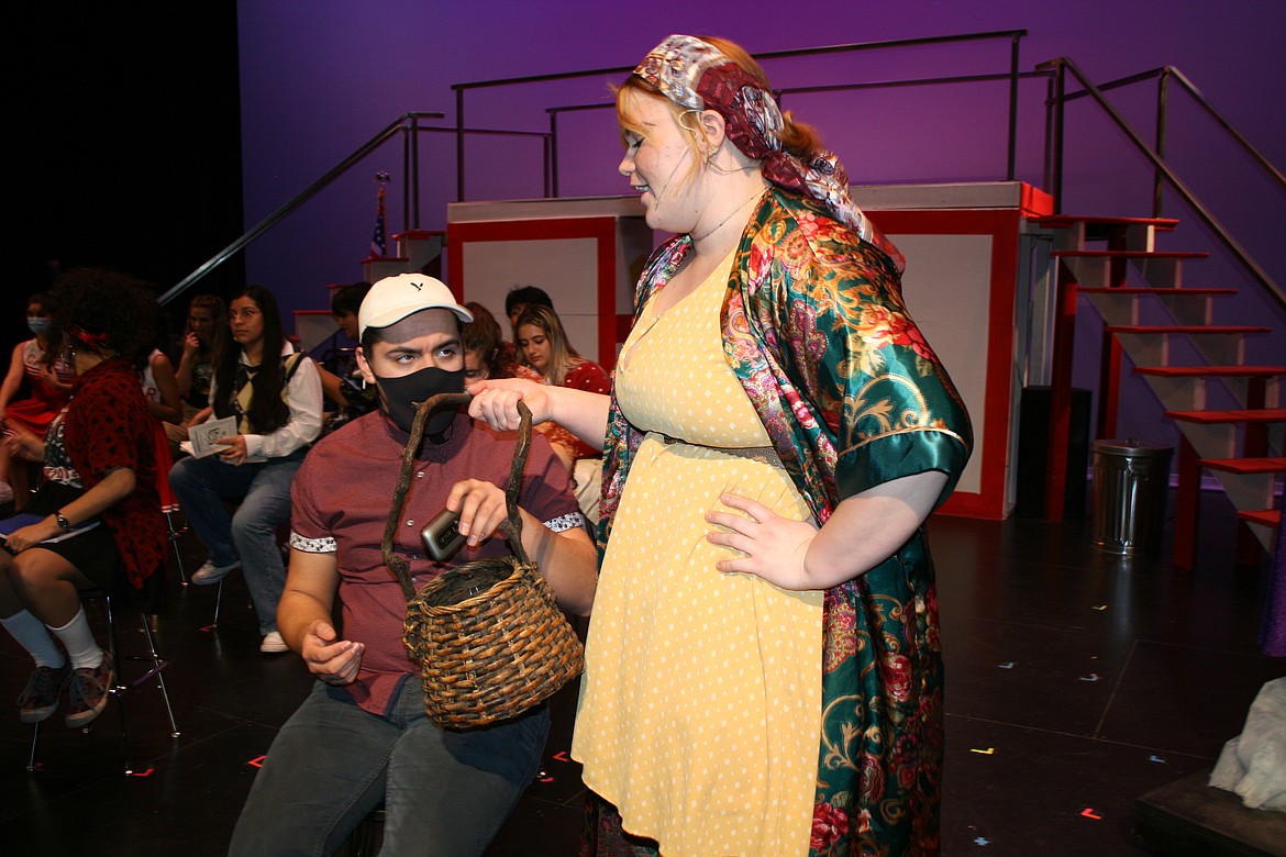 Ryan (Dawson Rubio, left) gives up his phone to Ms. Darbus (Emma Galloway, right). The Quincy High School Drama Club has been rehearsing regularly to make the show a success.