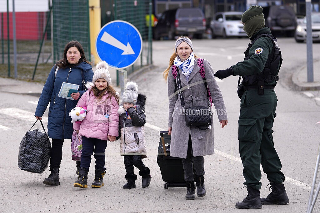 Refugees arrive from Ukraine at the border crossing Vysne Nemecke, Slovakia, Tuesday, March 1, 2022. (AP Photo/Darko Vojinovic)