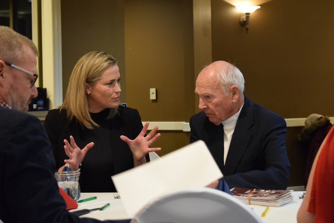 U.S. Senate candidate Tiffany Smiley converses with former state Sen. Harold Hochstatter prior to the start of the Grant County Republican Party’s Lincoln Day Dinner and fundraiser at the Pillar Rock Grill on Saturday.