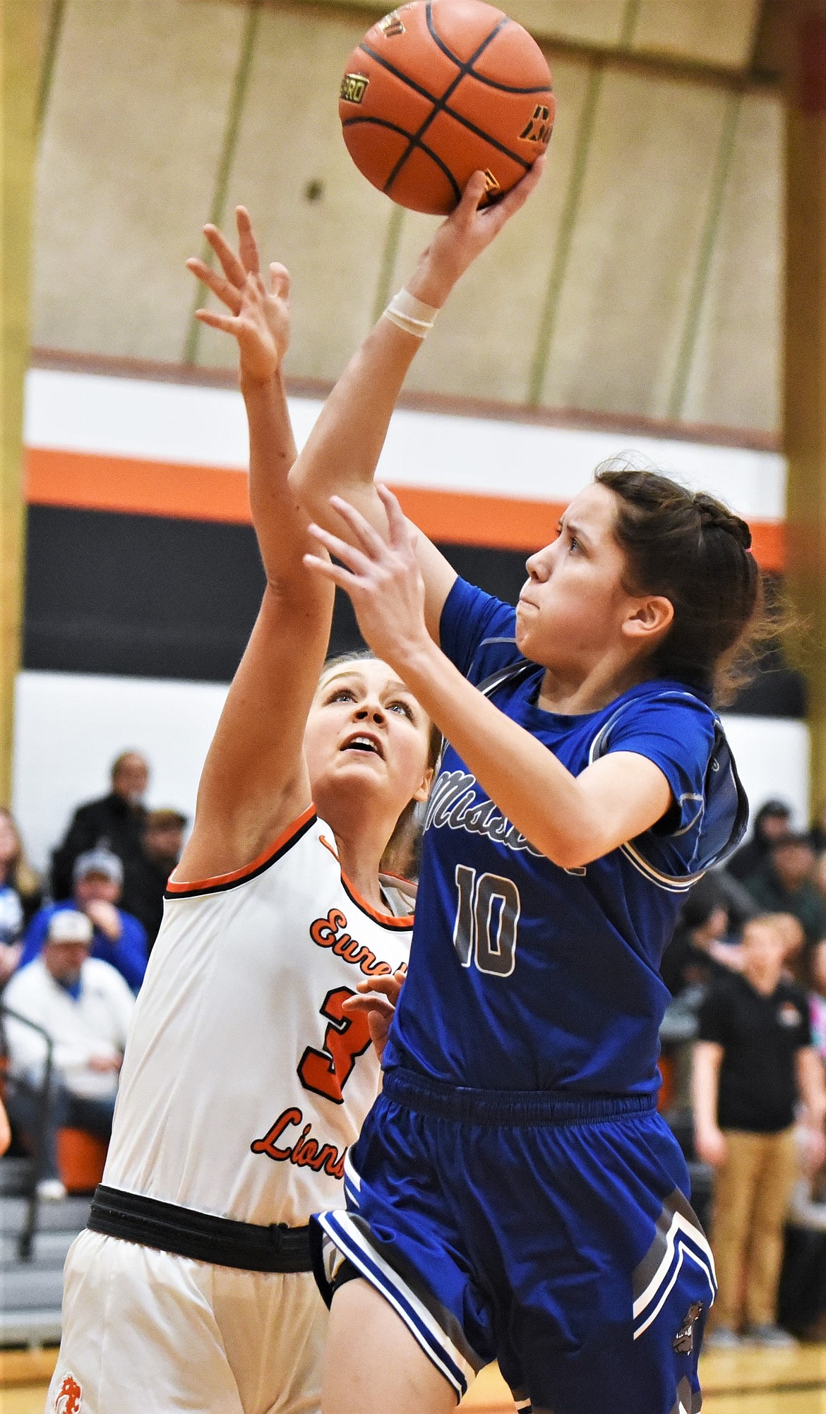 Mission's Madyson Currie shoots over Eureka's Reena Truman on Saturday. (Scot Heisel/Lake County Leader)